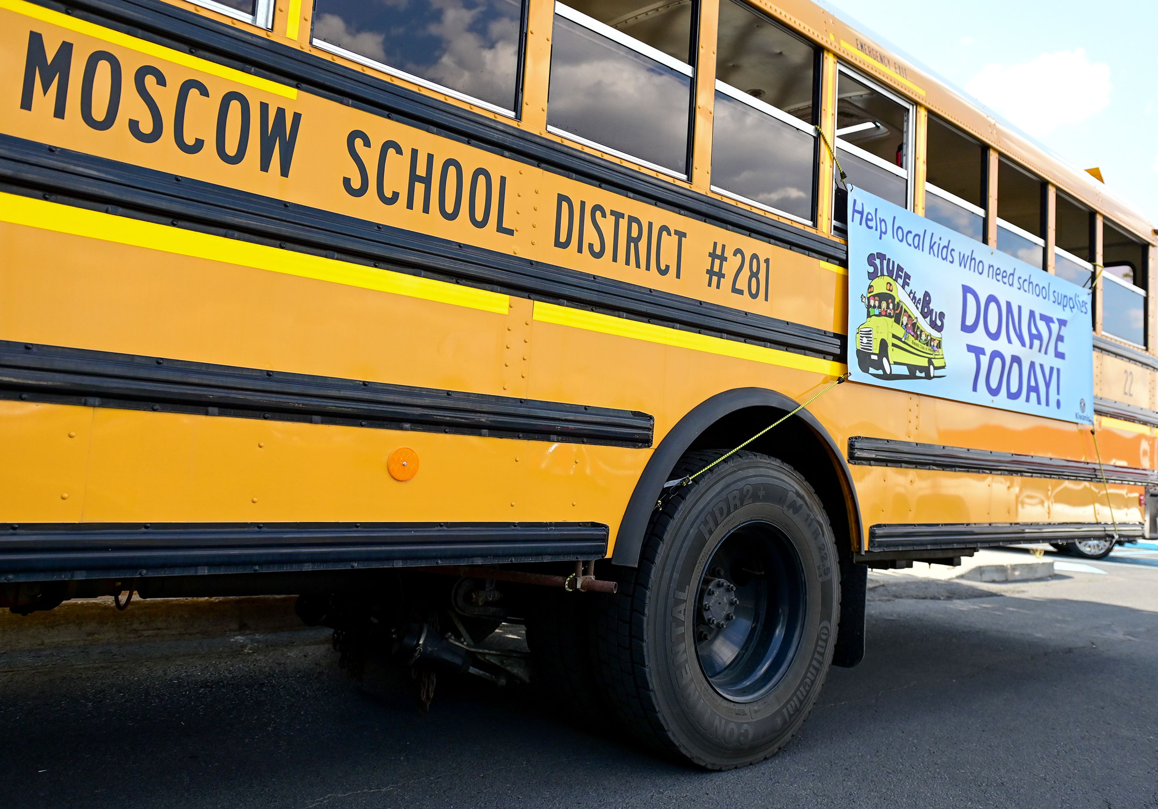 A Moscow school district bus sits in the Staples parking lot on Thursday in Moscow for the Stuff the Bus school supplies drive.