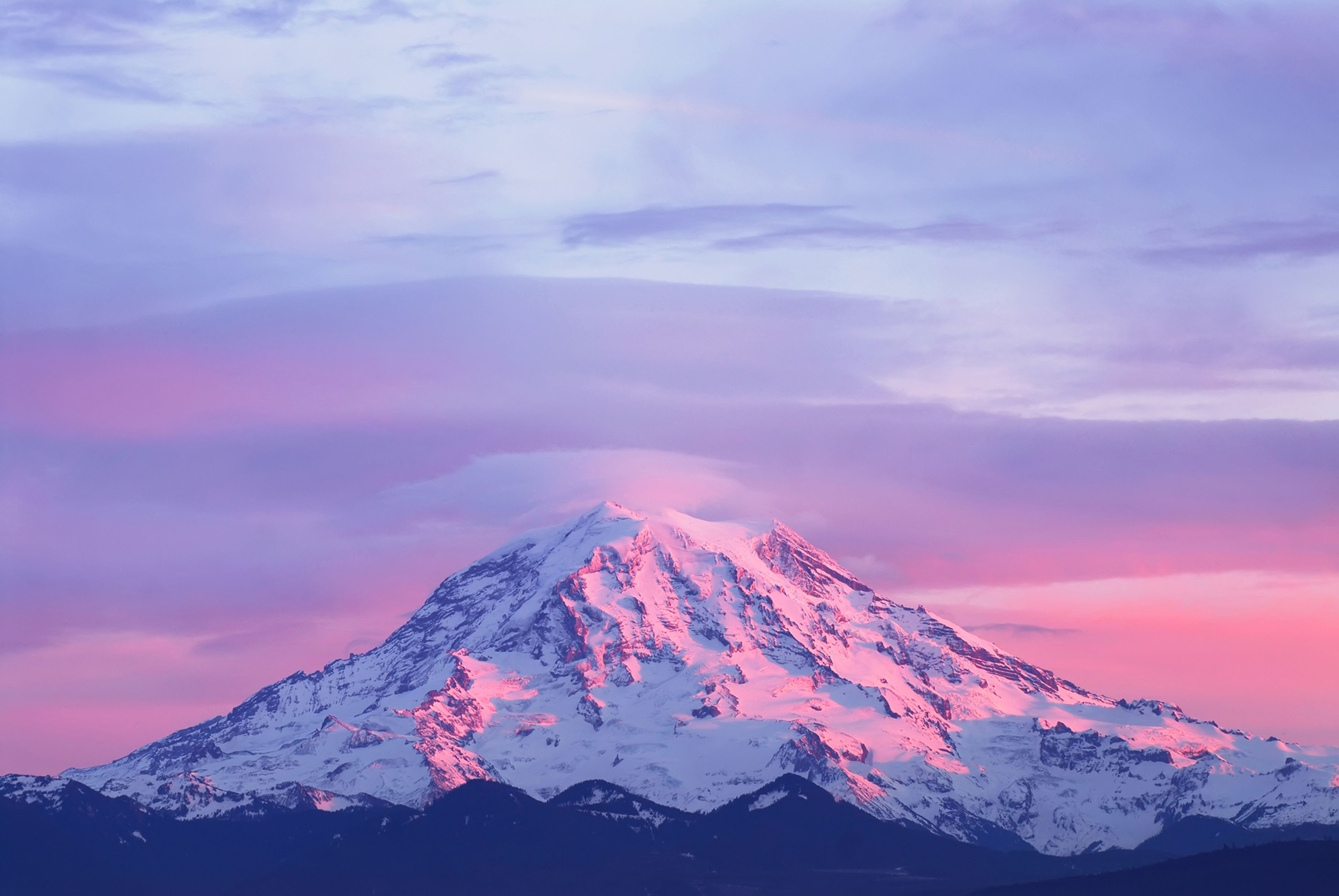 Sunset lights Mount Rainier in Washington state's Cascade Range.