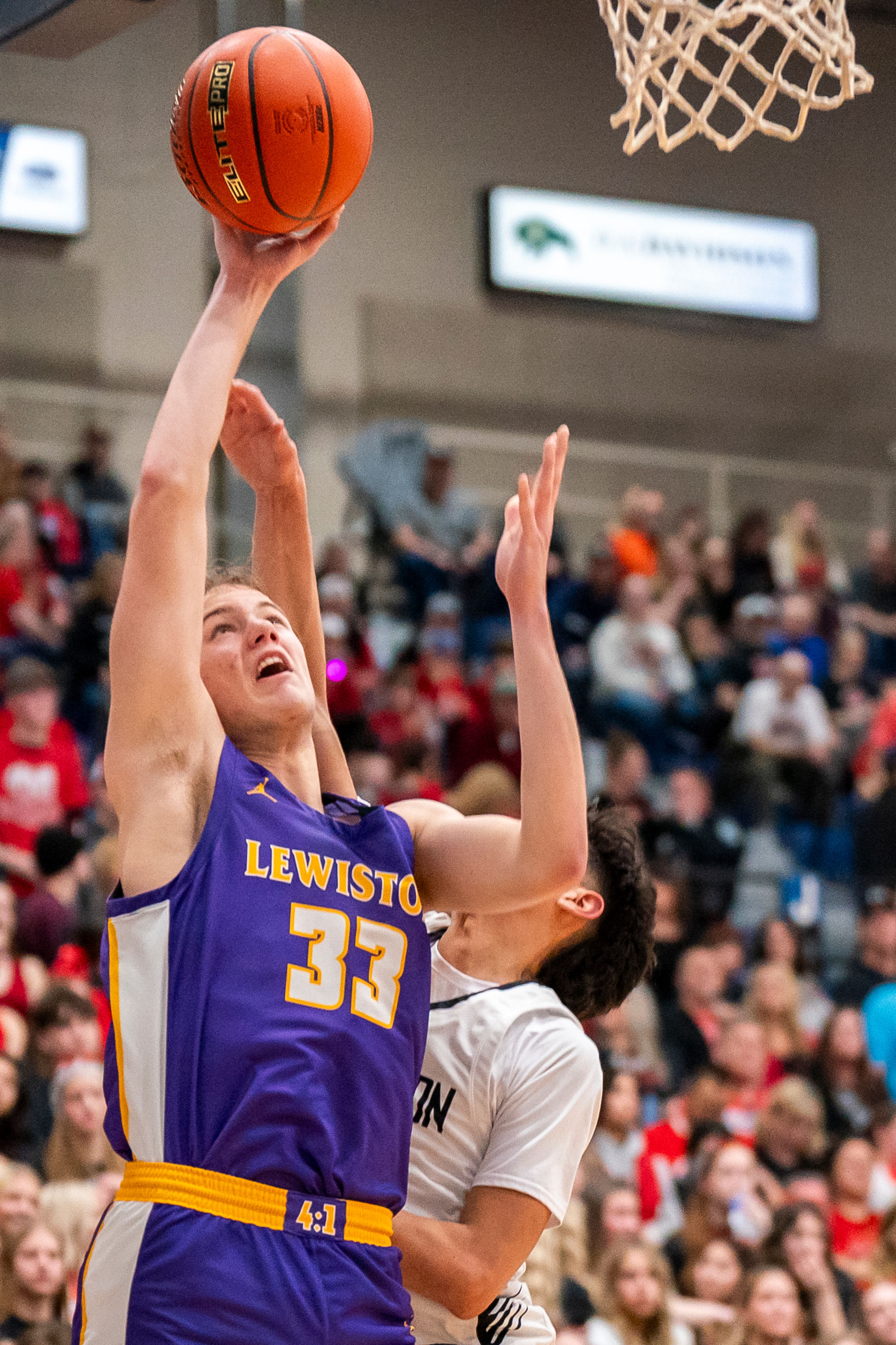 Lewiston’s Drew Hottinger (33) shoots the ball during their Golden Throne rivalry game against Clarkston on Friday inside the P1FCU Activity Center in Lewiston.