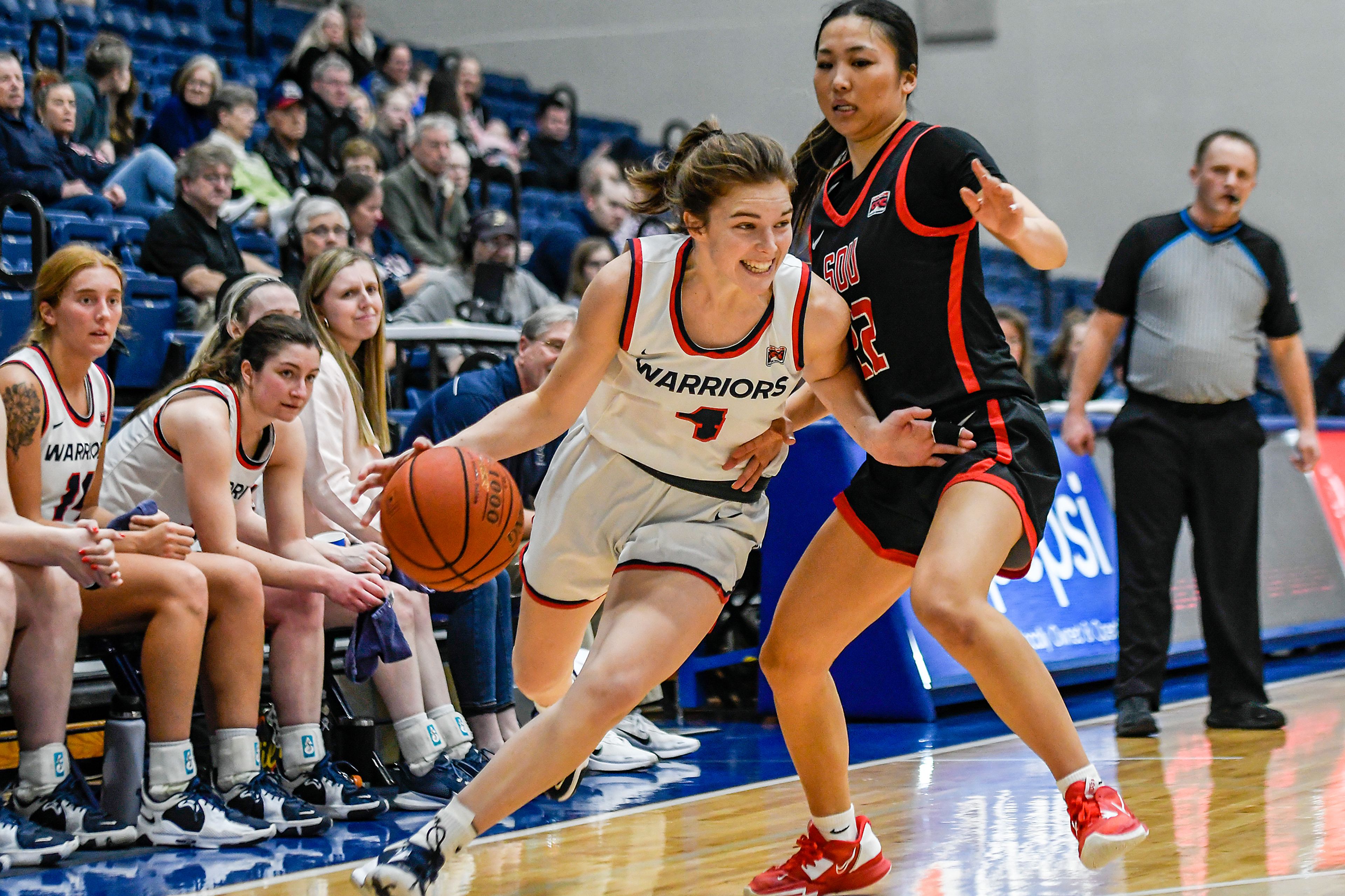 Lewis-Clark State guard Ellie Sander, left, drives toward the basket during Saturday's Cascade Conference game against Southern Oregon at the P1FCU Activity Center.