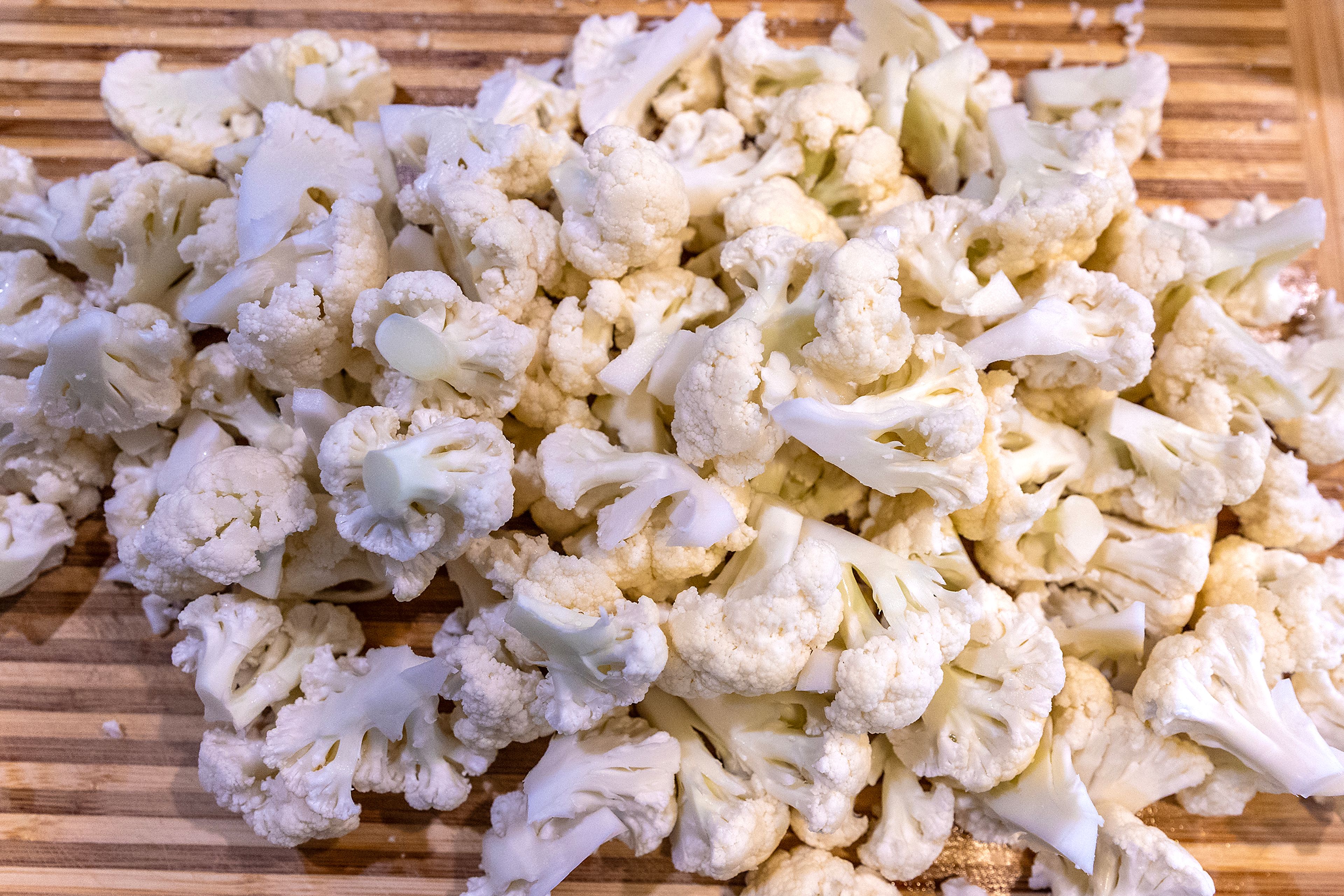 A cutting board sits with a large pile of cauliflower Sunday in Lewiston.