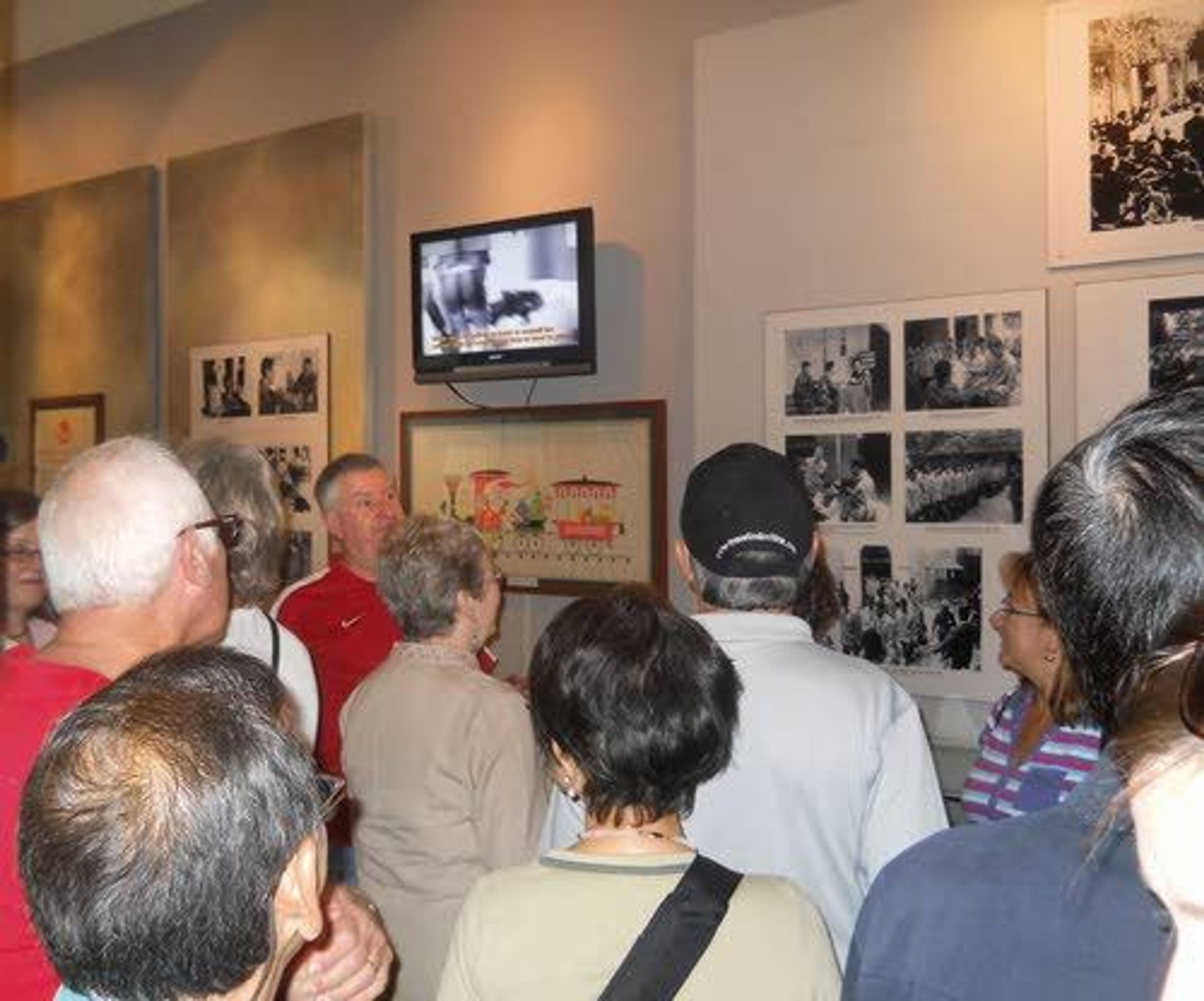 Former Prisoner of War Bob Chenoweth speaks to a group of tourists at the Hoa Lo (Hanoi Hilton) POW exhibit in 2013, 40 years after his release.