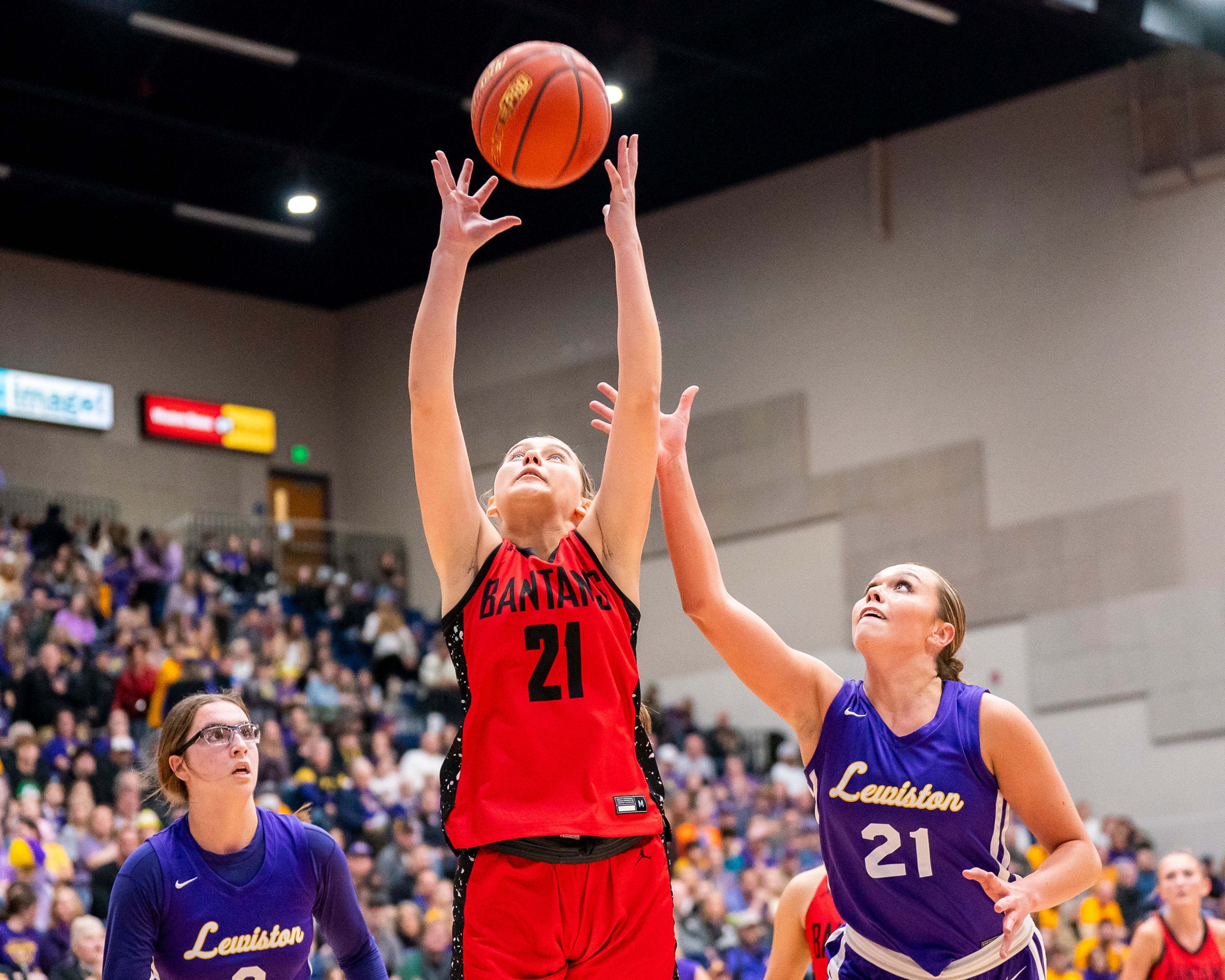 Clarkston’s Ella Leavitt (21) grabs a rebound during their Golden Throne rivalry game against Lewiston on Friday inside the P1FCU Activity Center in Lewiston.