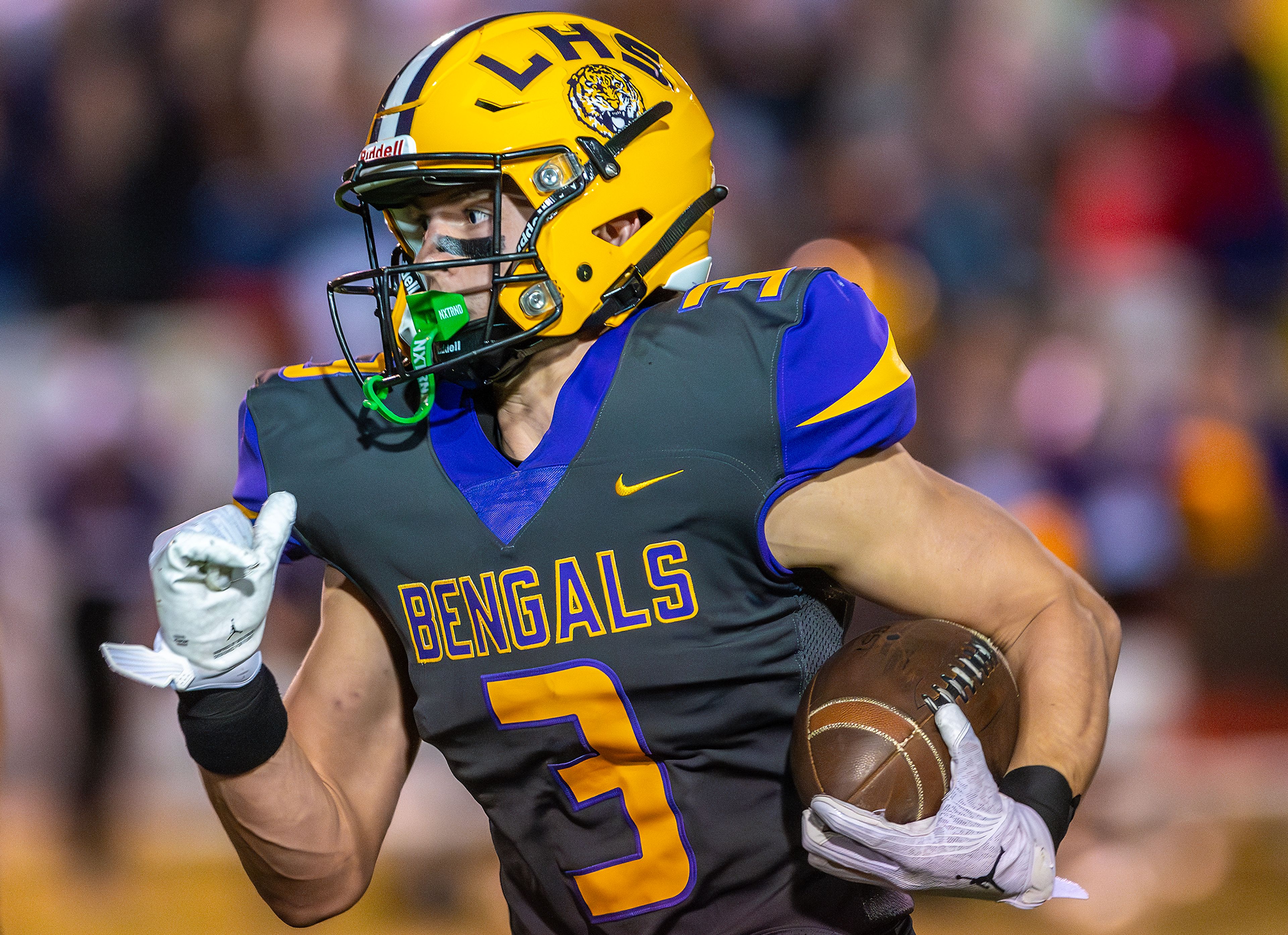 Lewiston wide receiver Drew Alldredge runs the ball in for a touchdown against Hermiston during a nonconference game at Bengal Field Friday in Lewiston.,