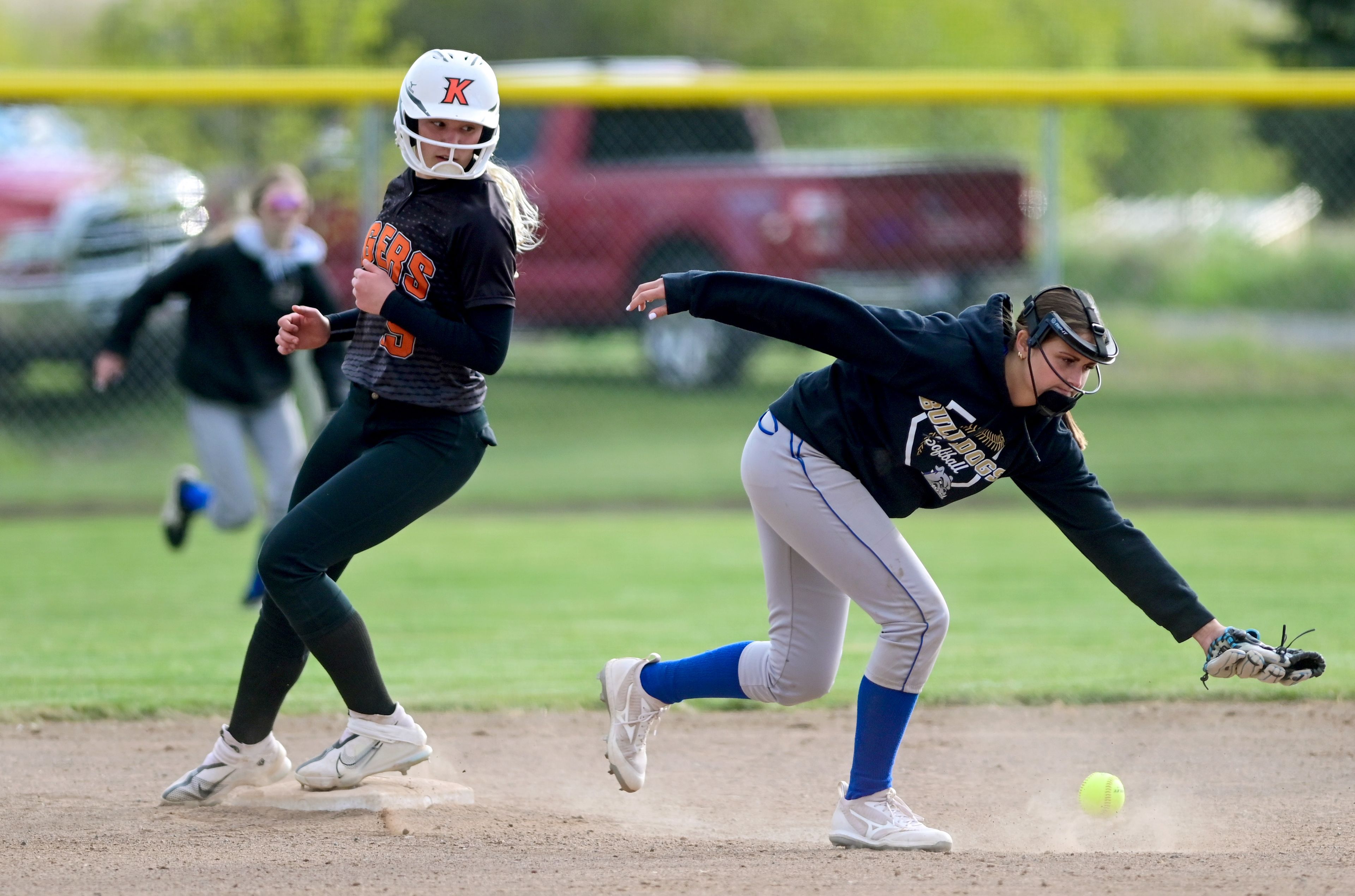 Kendrick’s Hayden Kimberling makes it safely to second base as Genesee’s Riley Leseman reaches for the ball during an Idaho 2A district tournament championship game Wednesday in Genesee.