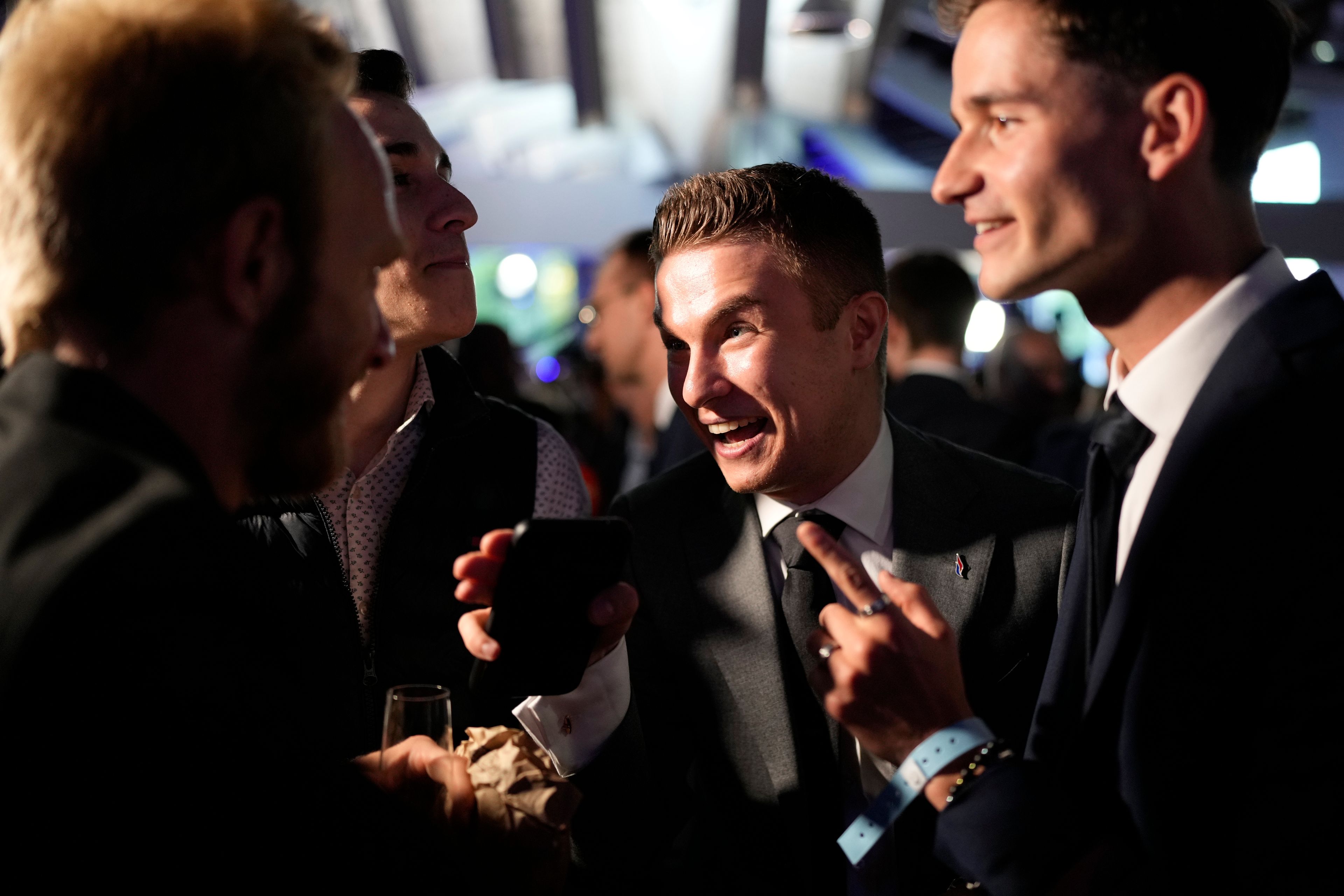 Supporters of French far-right National Rally react at the party election night headquarters after French President Emanuel Macron announced he dissolves National Assembly and calls new legislative election after defeat in EU vote, Sunday, June 9, 2024 in Paris. First projected results from France put far-right National Rally party well ahead in EU elections, according to French opinion poll institutes.