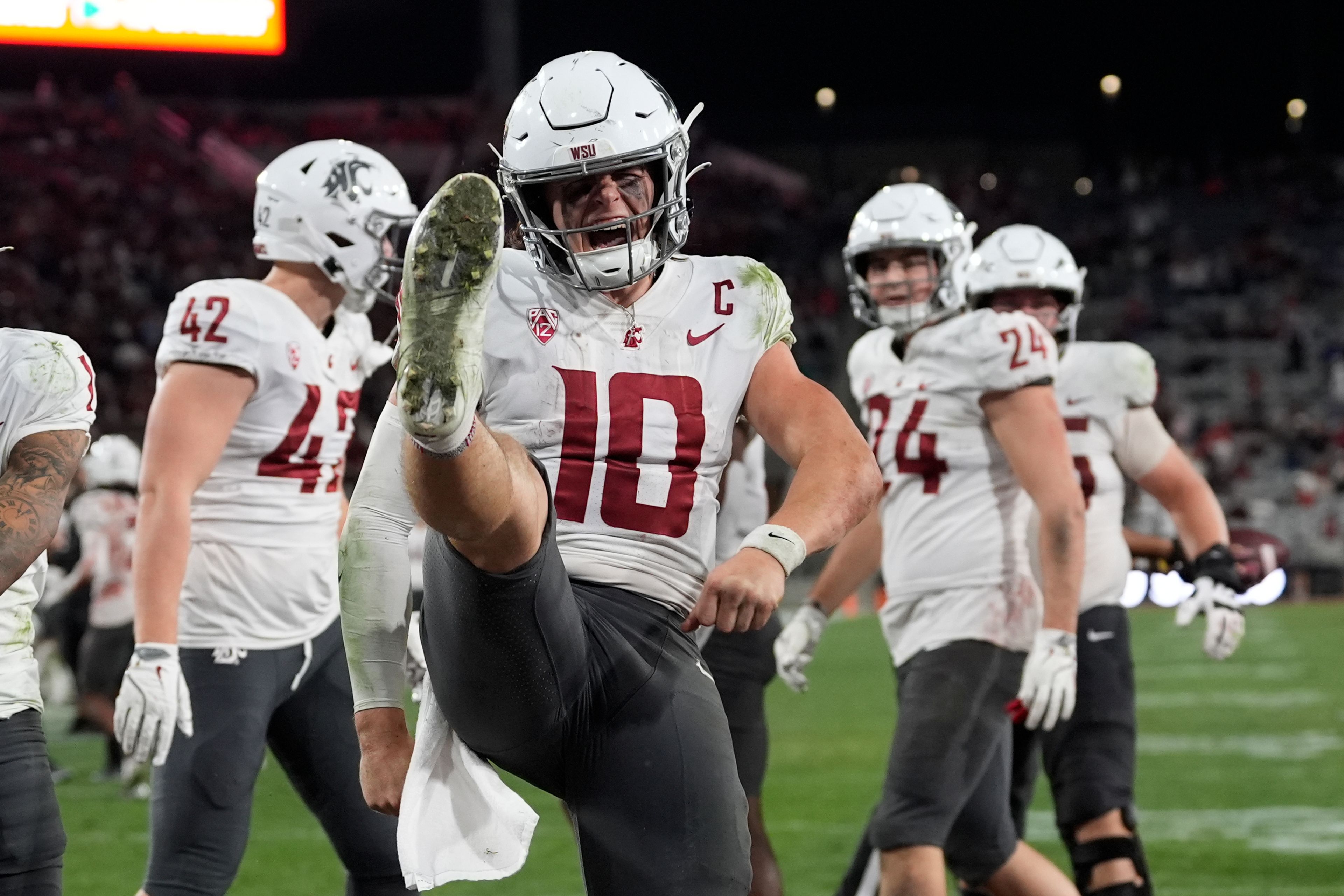 Washington State quarterback John Mateer (10) celebrates a touchdown during the second half of an NCAA college football game against San Diego State Saturday, Oct. 26, 2024, in San Diego. (AP Photo/Gregory Bull)