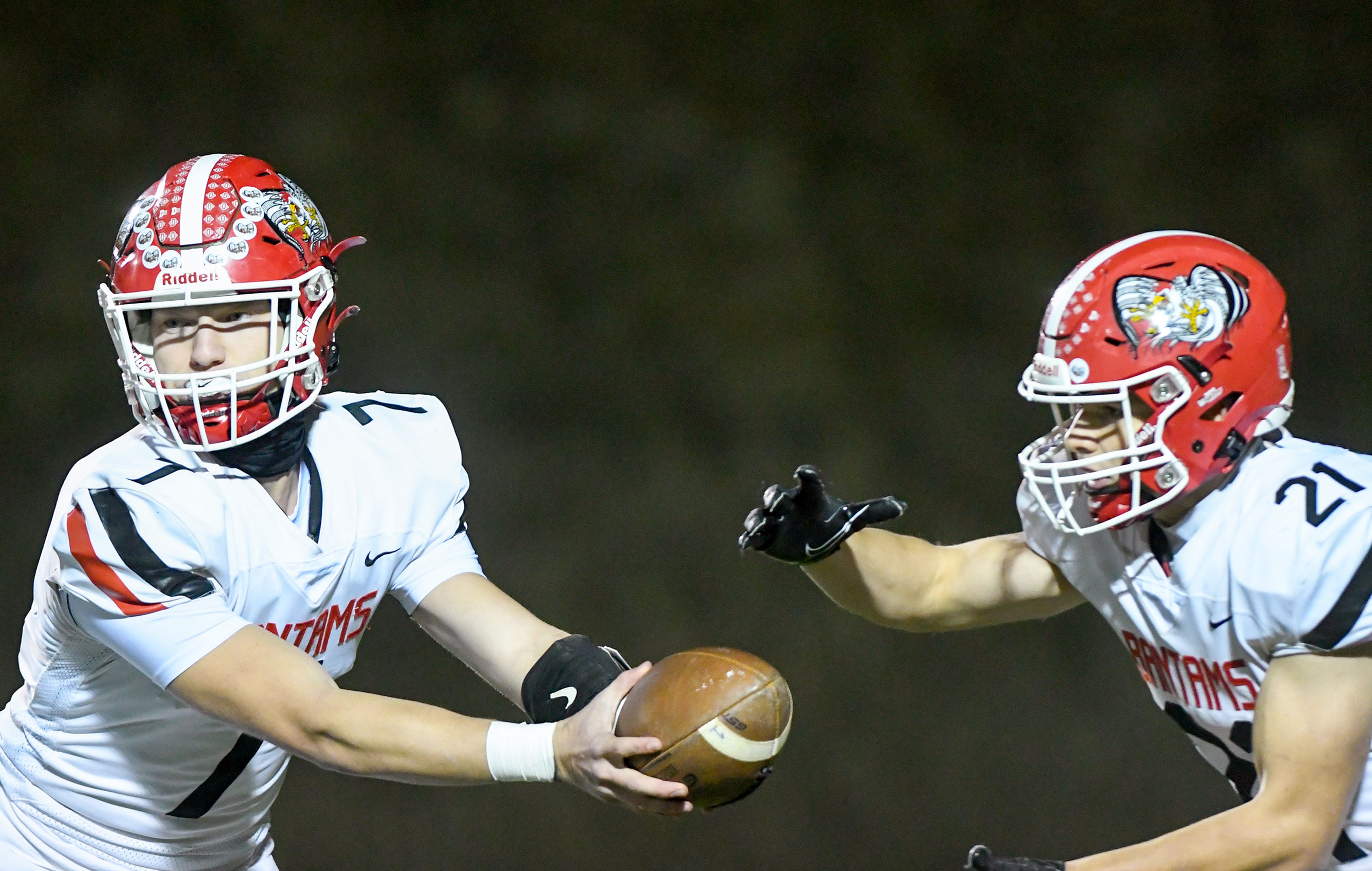 Clarkstons Hayden Line hands the ball off to Milo Kunnap at the start of a play against Pullman Friday in Pullman.,