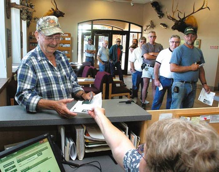 Hunters line up to buy wolf tags