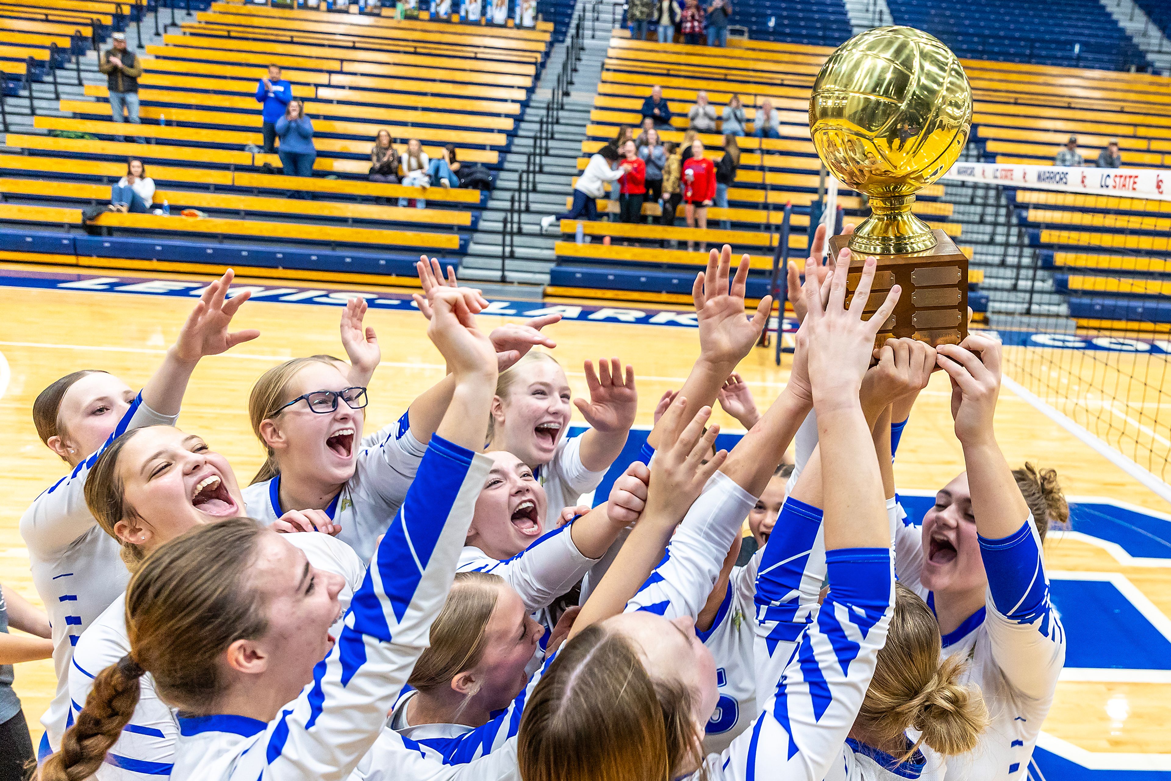 Genesee celebrates defeating St. John Bosco in three sets in a 1A district championship Thursday at the P1FCU Activity Center in Lewiston.,