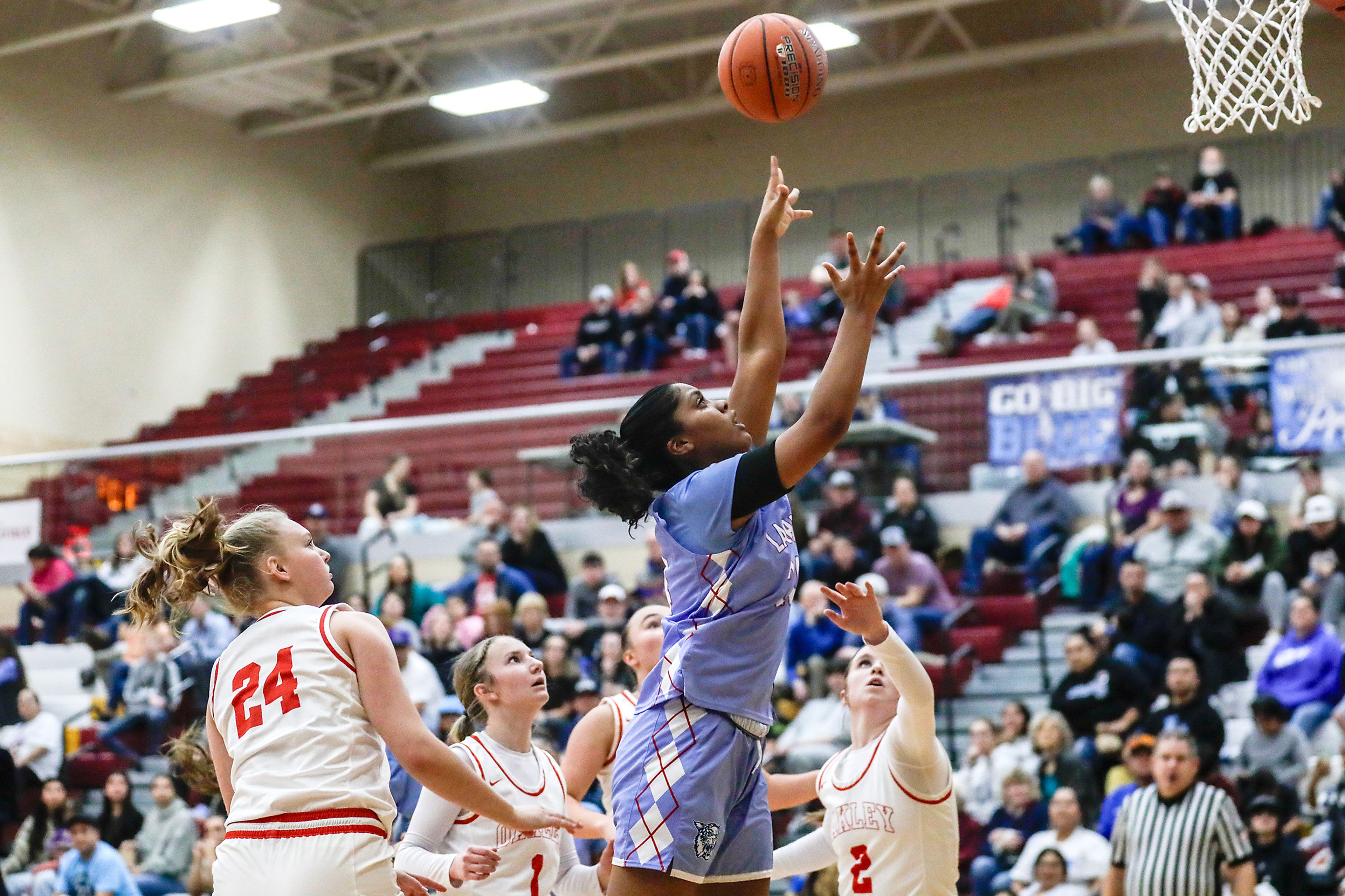 Lapwai's Qubilah Mitchell puts the ball in during an Idaho Class 1A DI girls state semifinal game Friday at Columbia High School.