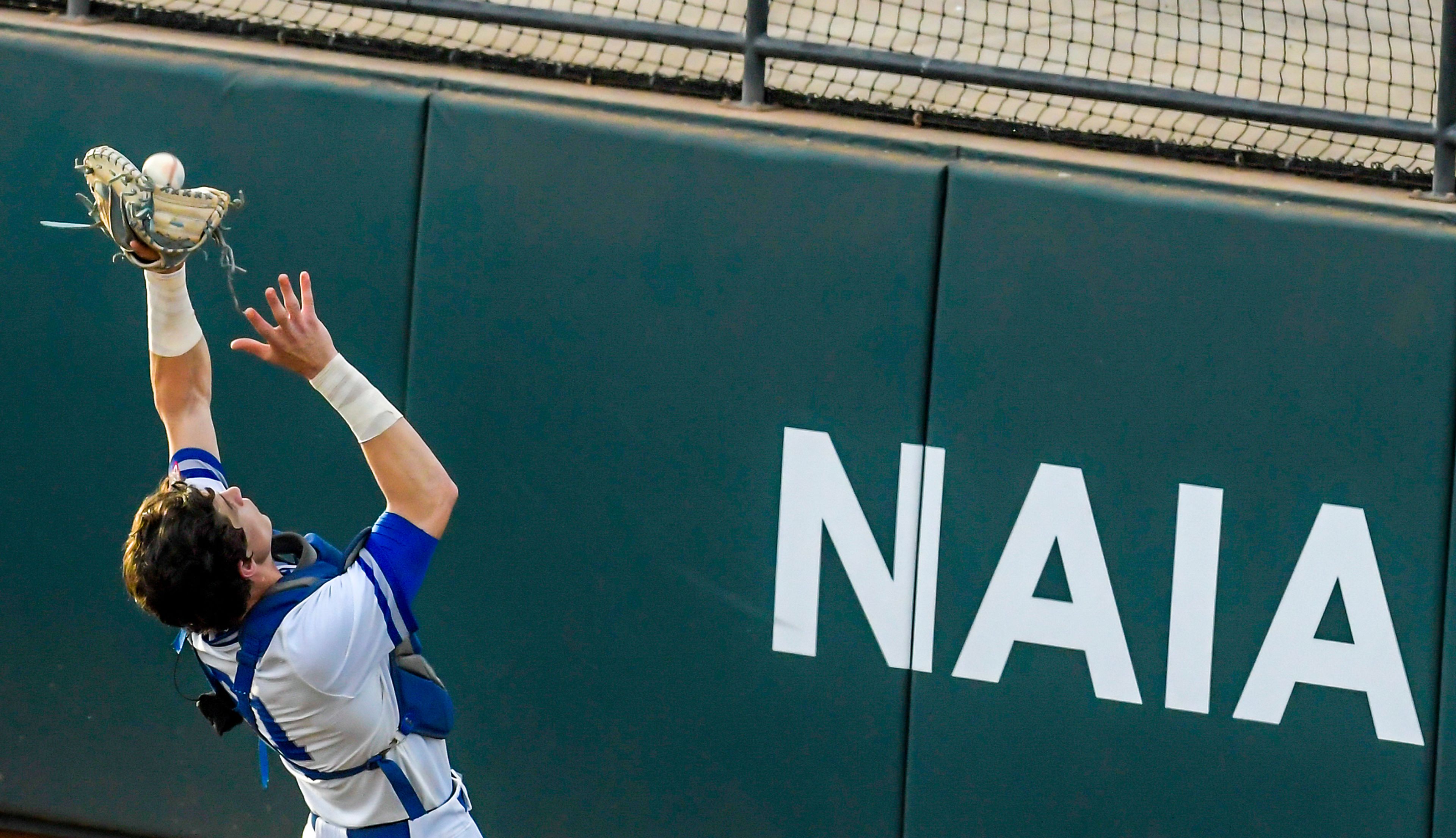 Tennessee Wesleyan catcher Daniel Stewart makes a catch against Reinhardt in Game 18 of the NAIA World Series at Harris Field Thursday in Lewiston.