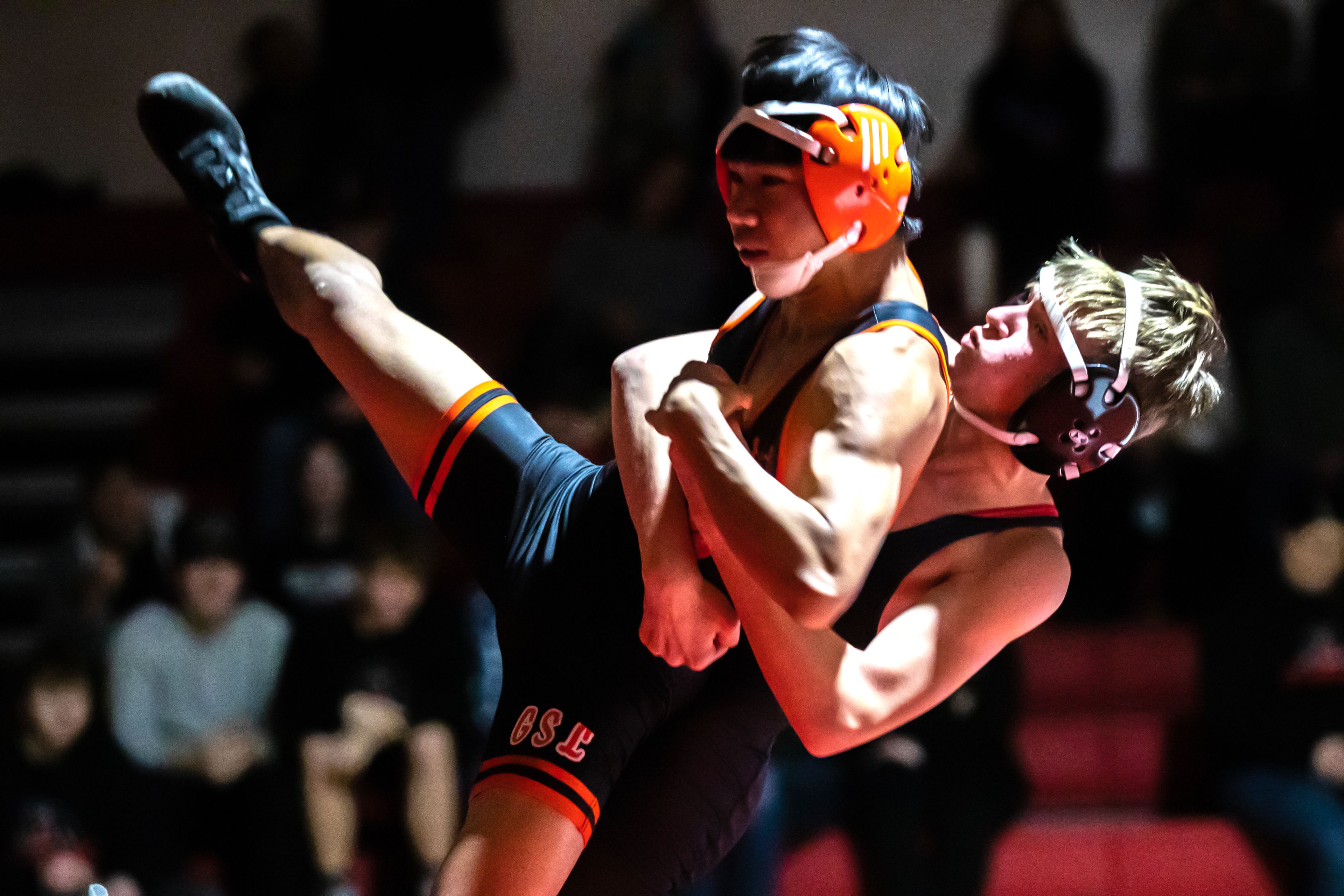 Clarkston’s Raiden Douglas throws West Valley’s Jaxn Fraser to the mat in the 113 pound weight class match during a wrestling duel Wednesday at Clarkston.