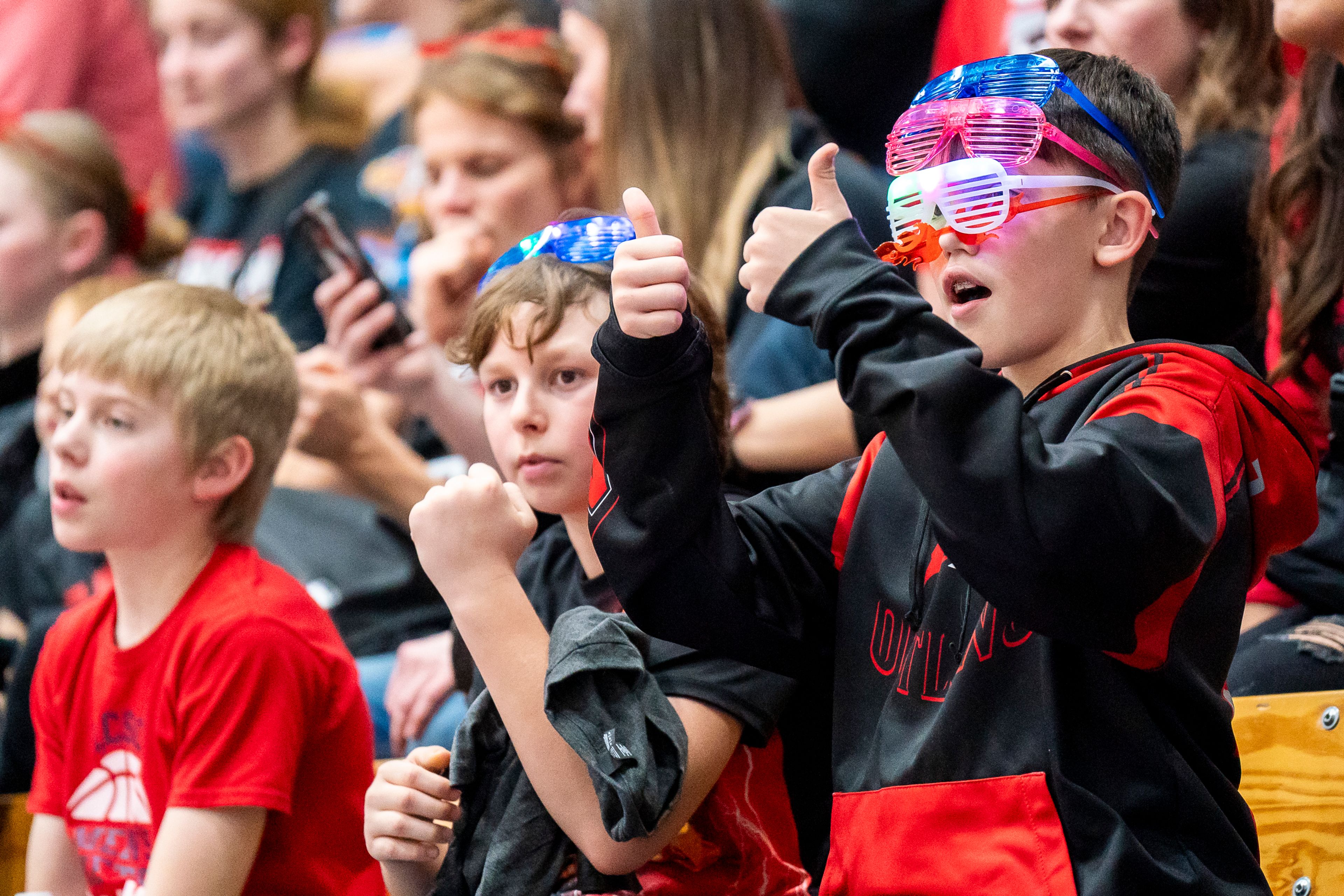 Parker McCall, 12, rocks multiple pairs of glasses as he cheers for Clarkston during their girl’s basketball Golden Throne rivalry game against Lewiston on Friday inside the P1FCU Activity Center in Lewiston.