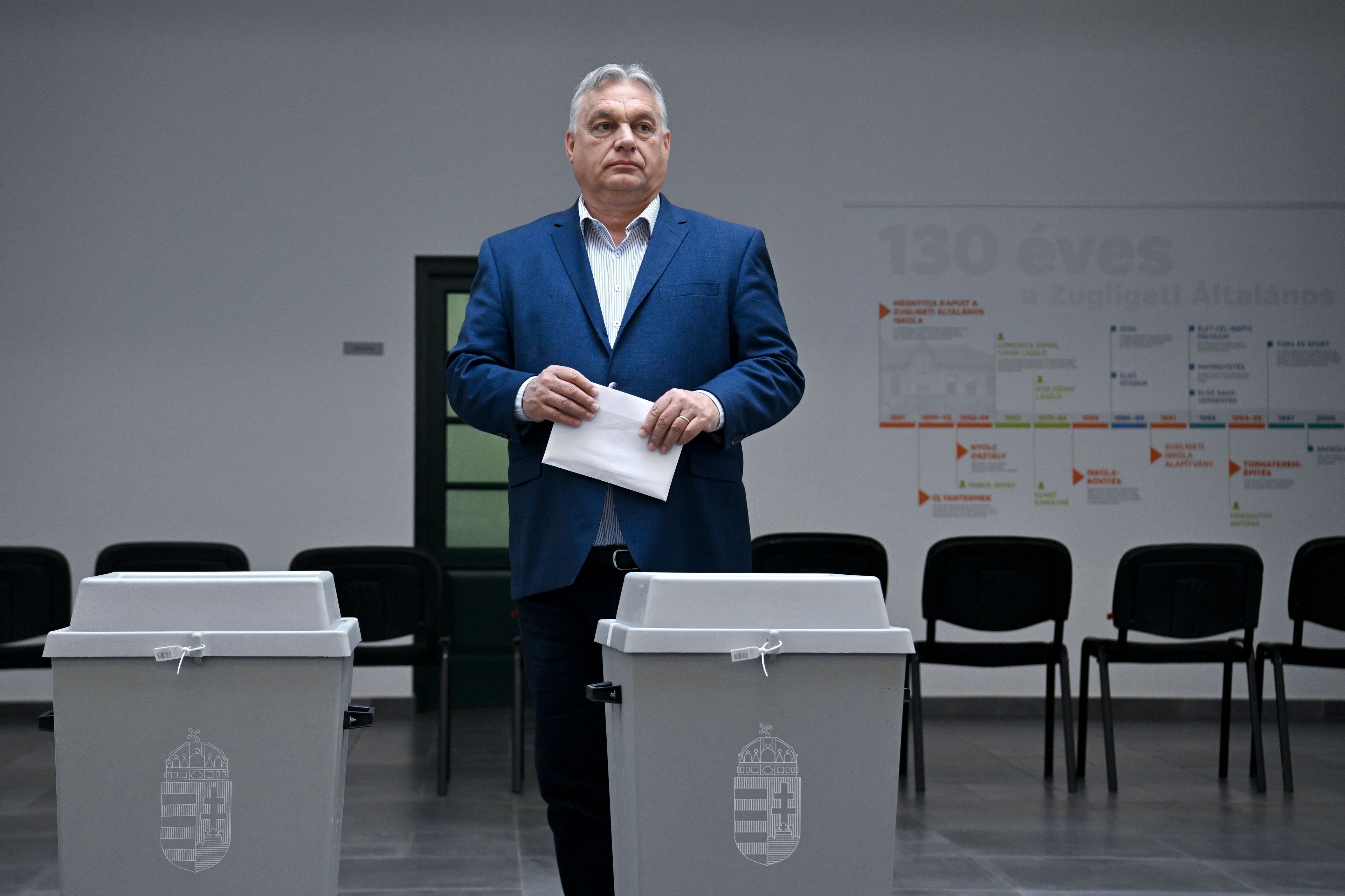 Hungarian Prime Minister Viktor Orban, leader of the ruling Fidesz party prepares to cast his vote at a polling station during the European Parliament and the local elections in Budapest, Hungary, Sunday June 9, 2024.