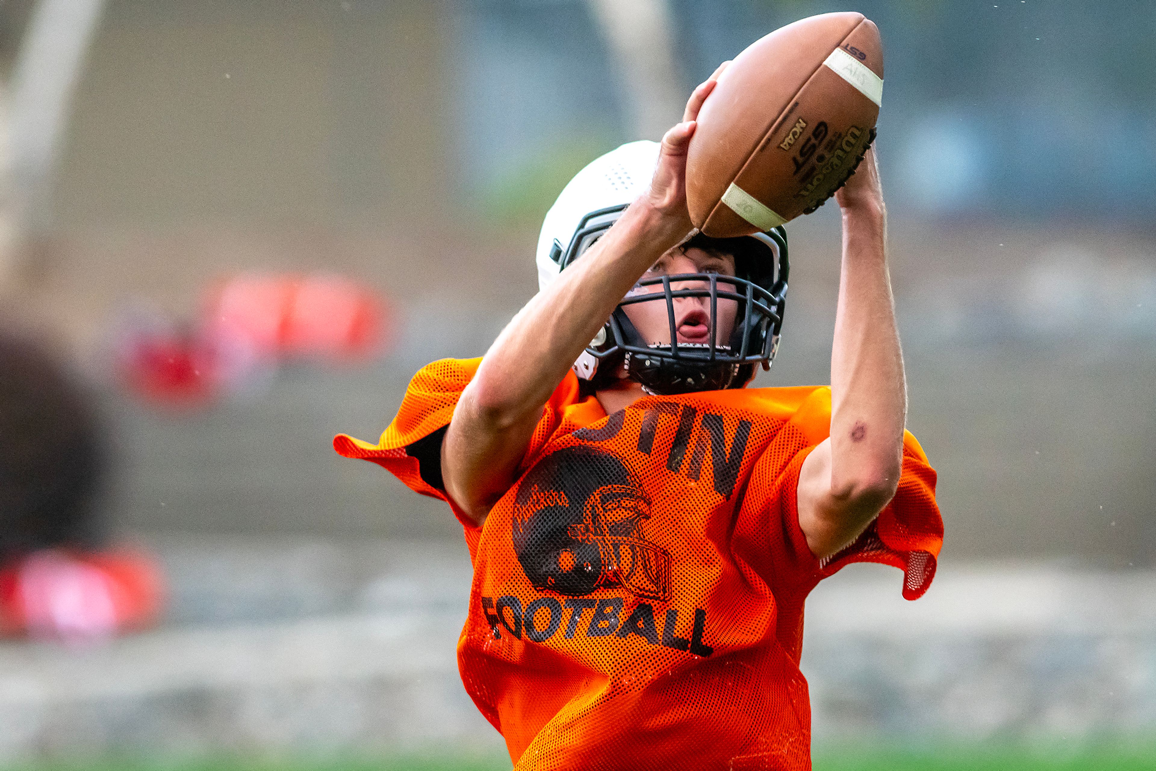 Wyatt Caldwell makes a catch at football practice Monday in Asotin.