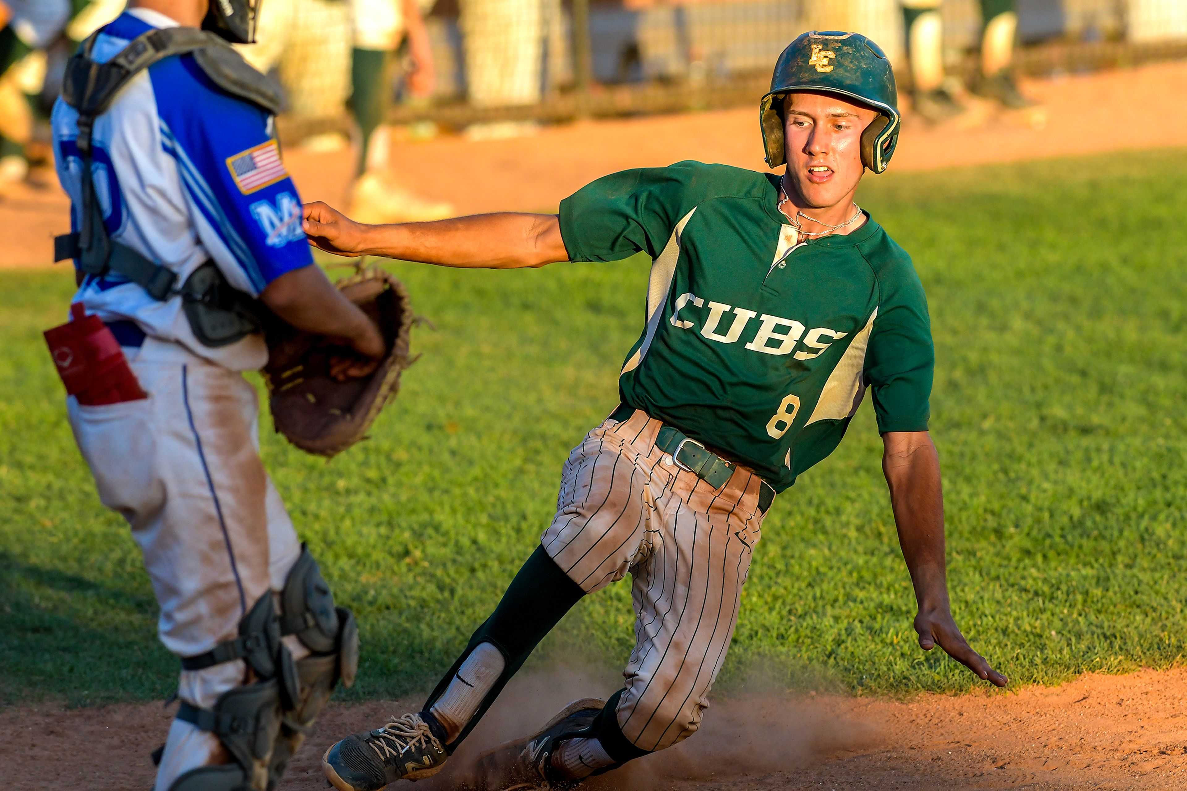 The Lewis-Clark Cubs' Luke Crosby goes into a slide into home against Moscow in a game of the Clancy Ellis Tournament on Saturday at Harris Field in Lewiston.