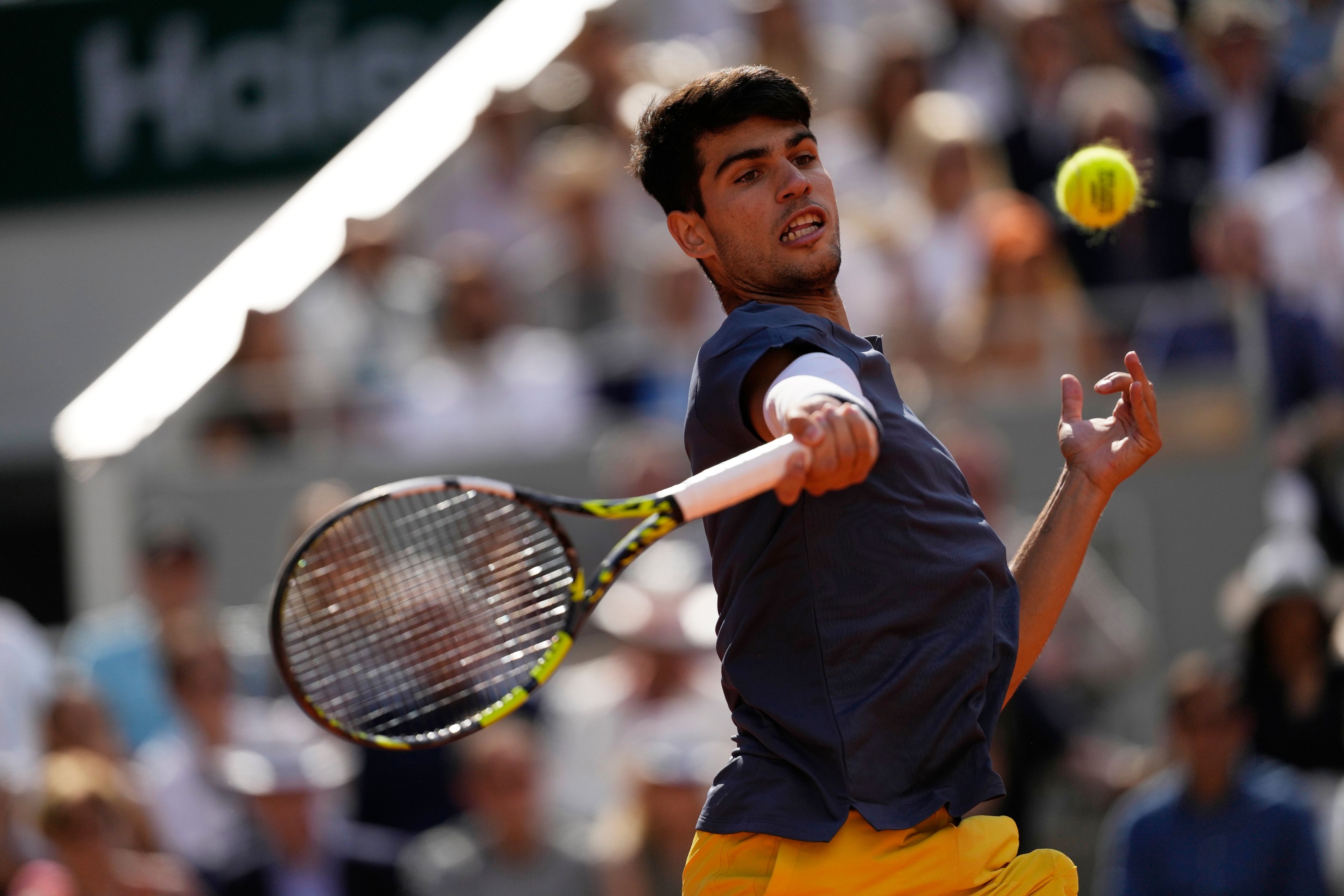 Spain's Carlos Alcaraz plays a shot against Germany's Alexander Zverev during the men's final match of the French Open tennis tournament at the Roland Garros stadium in Paris, Sunday, June 9, 2024.