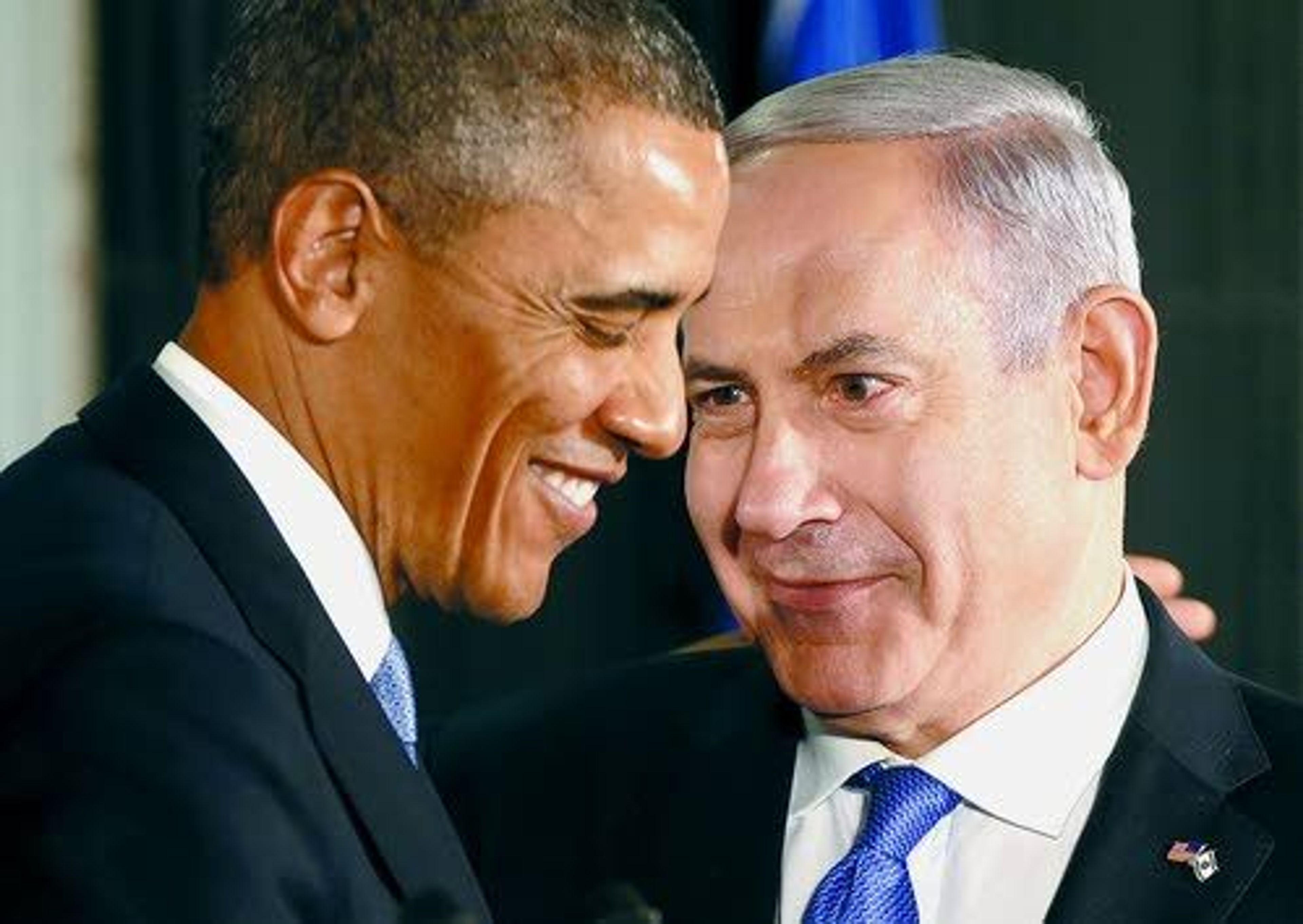 In this photo taken March 20, 2013, President Barack Obama and Israeli Prime Minister Benjamin Netanyahu huddle during their joint news conference in Jerusalem, Israel.