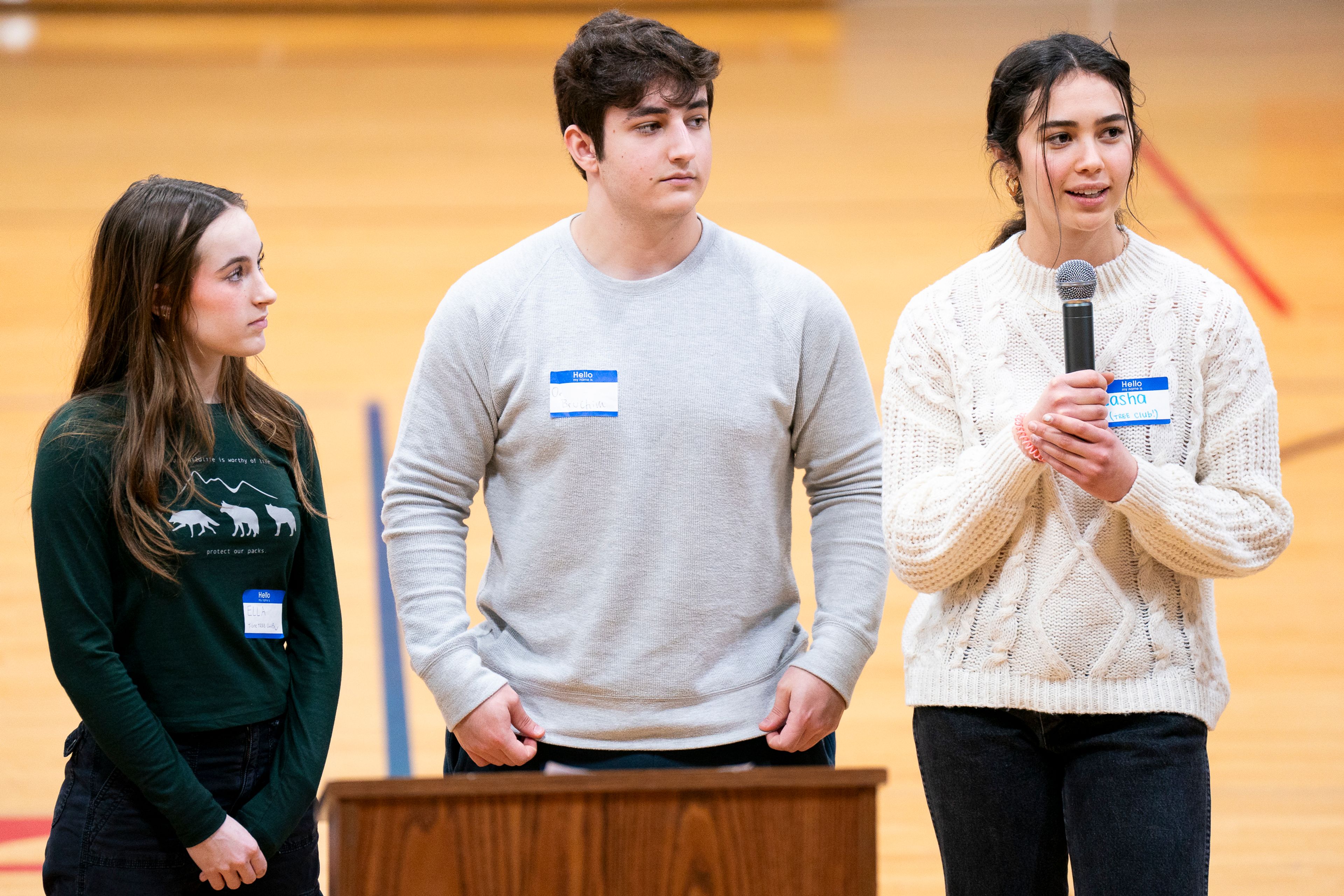 Sasha Truax, right, and other students of Teens Restoring Earth’s Environment at Timber High School in Boise speak to the crowd during the Honor the Wolf Ceremony inside Pi-Nee-Waus Community Center in Lapwai on Saturday