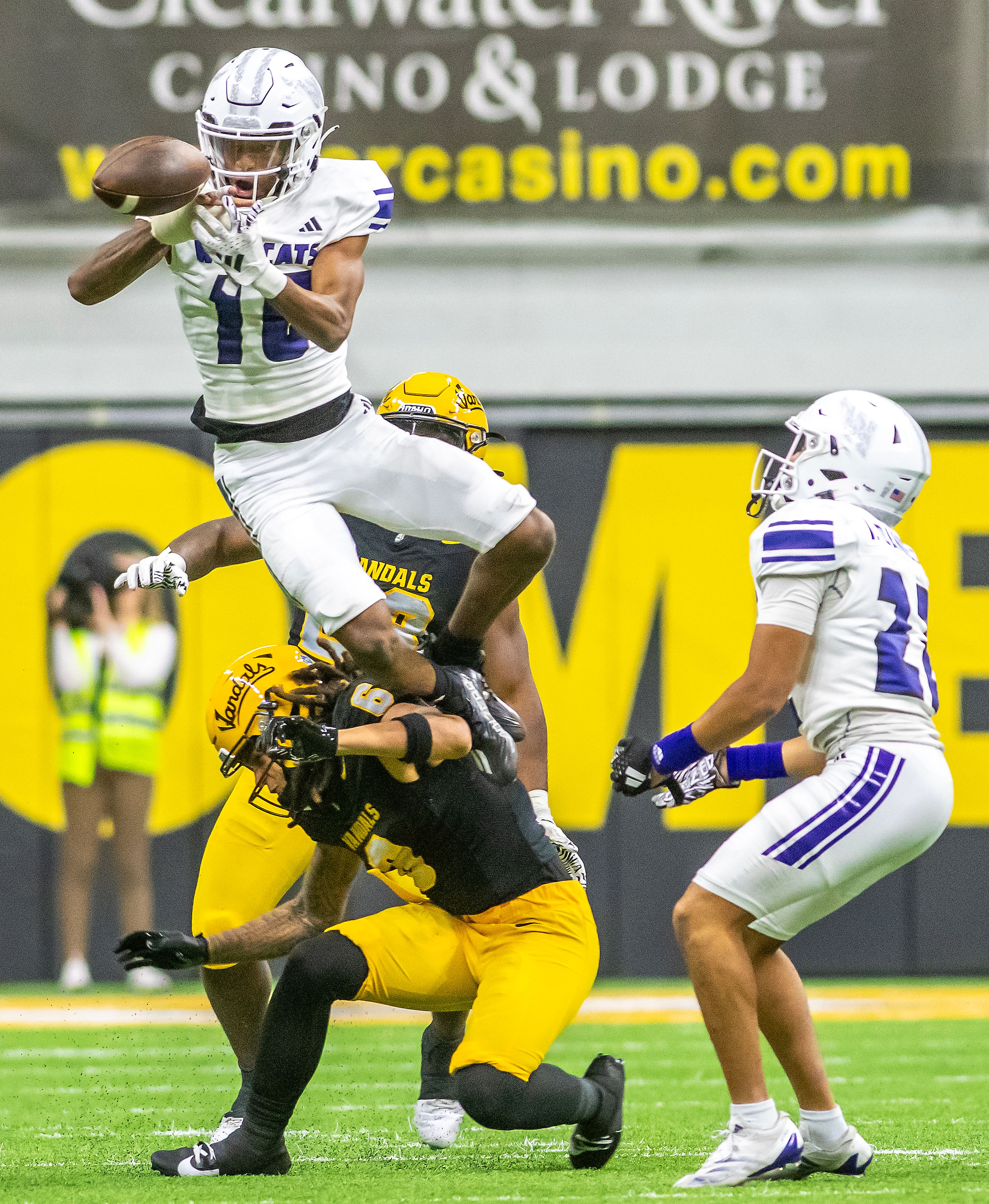 Weber State cornerback Toddrick Dixon breaks up a pass intended for Idaho wide receiver Jordan Dwyer which was then caught by his teammate Weber State cornerback Ishaan Daniels (right) during a quarter of a Big Sky conference game Saturday at the P1FCU Kibbie Dome in Moscow.