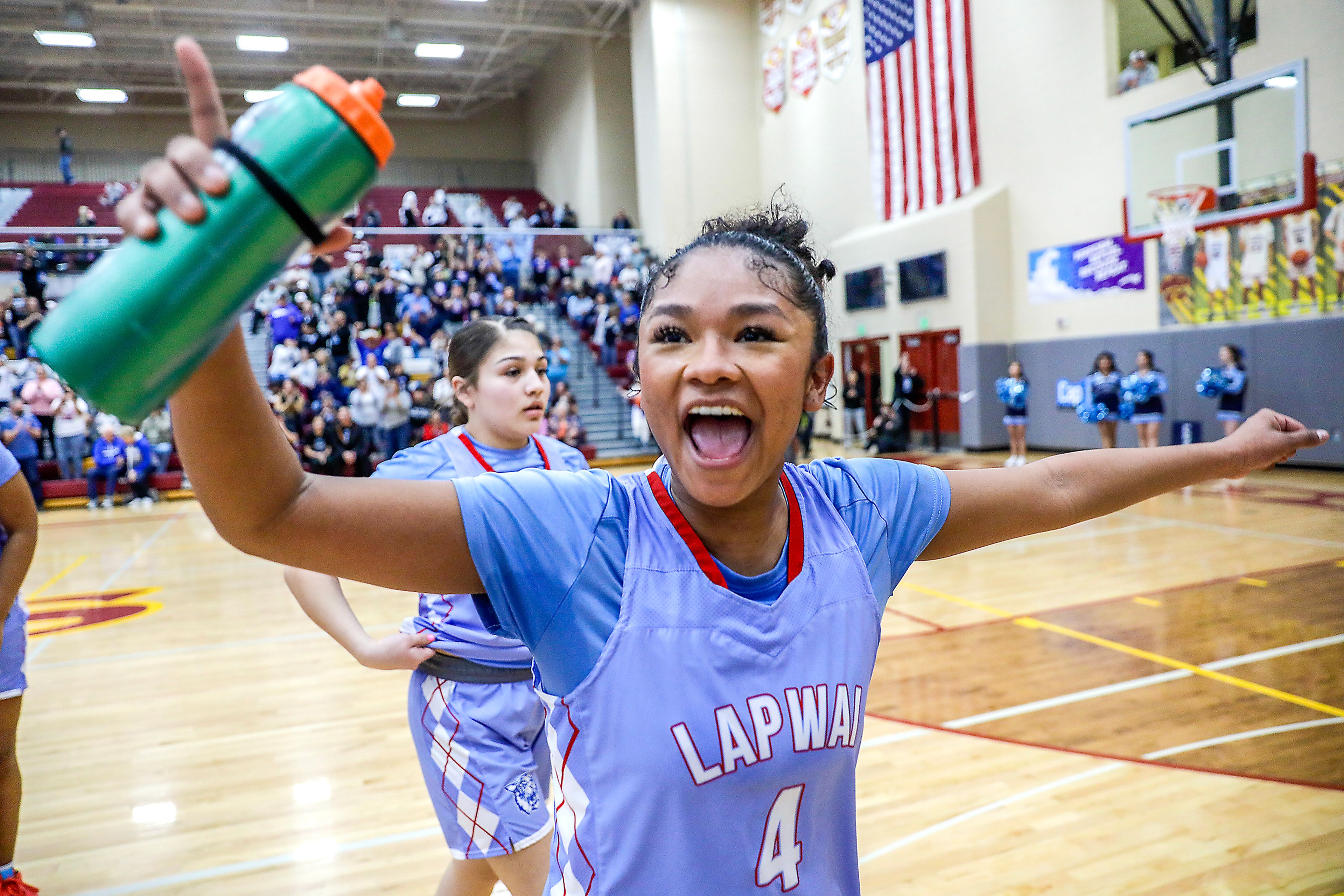 Lapwai's Samara Powaukee celebrates against Oakley during an Idaho Class 1A DI girls state semifinal game Friday at Columbia High School.