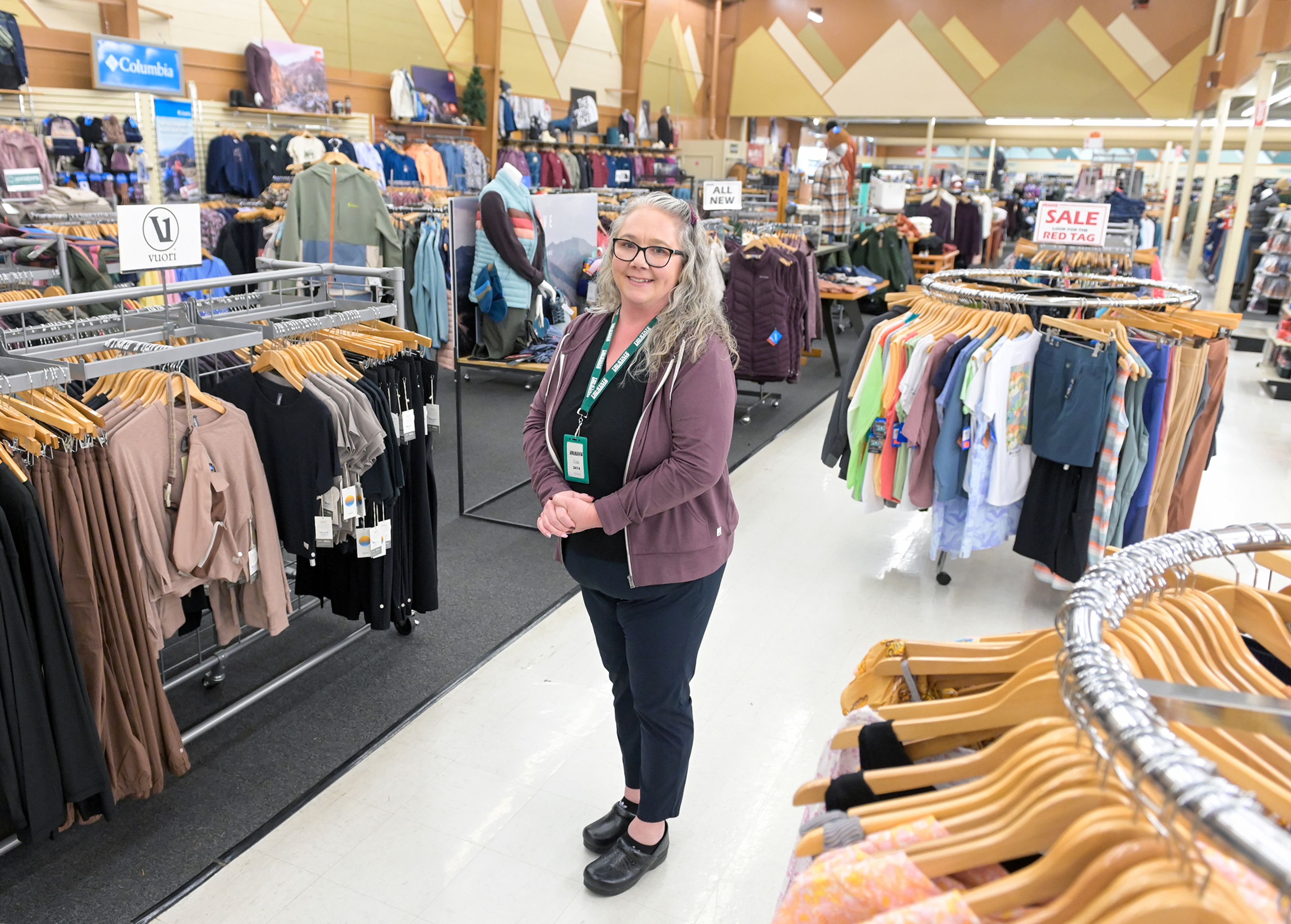 Store manager Liza Harwood stands an apparel section of Tri-State Outfitters Wednesday in Moscow.