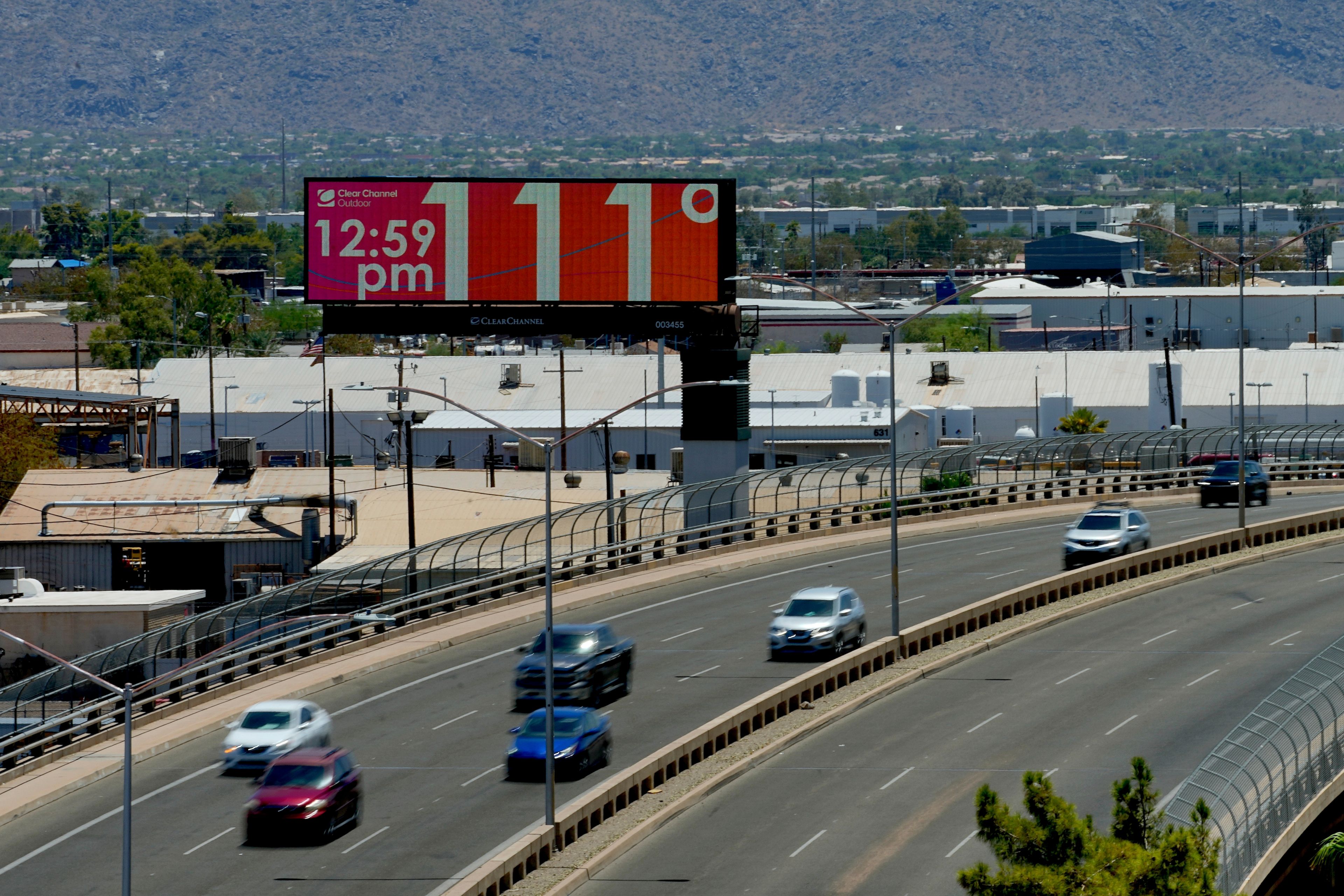 FILE - A digital billboard displays an unofficial temperature, on July 17, 2023, in downtown Phoenix. The death certificates of more than 2,300 people who died in the United States last summer mention the effects of excessive heat, the highest number in 45 years of records, according to an Associated Press analysis of Centers for Disease Control and Prevention data. With May already breaking heat records, 2024 could be even deadlier. (AP Photo/Matt York, File)