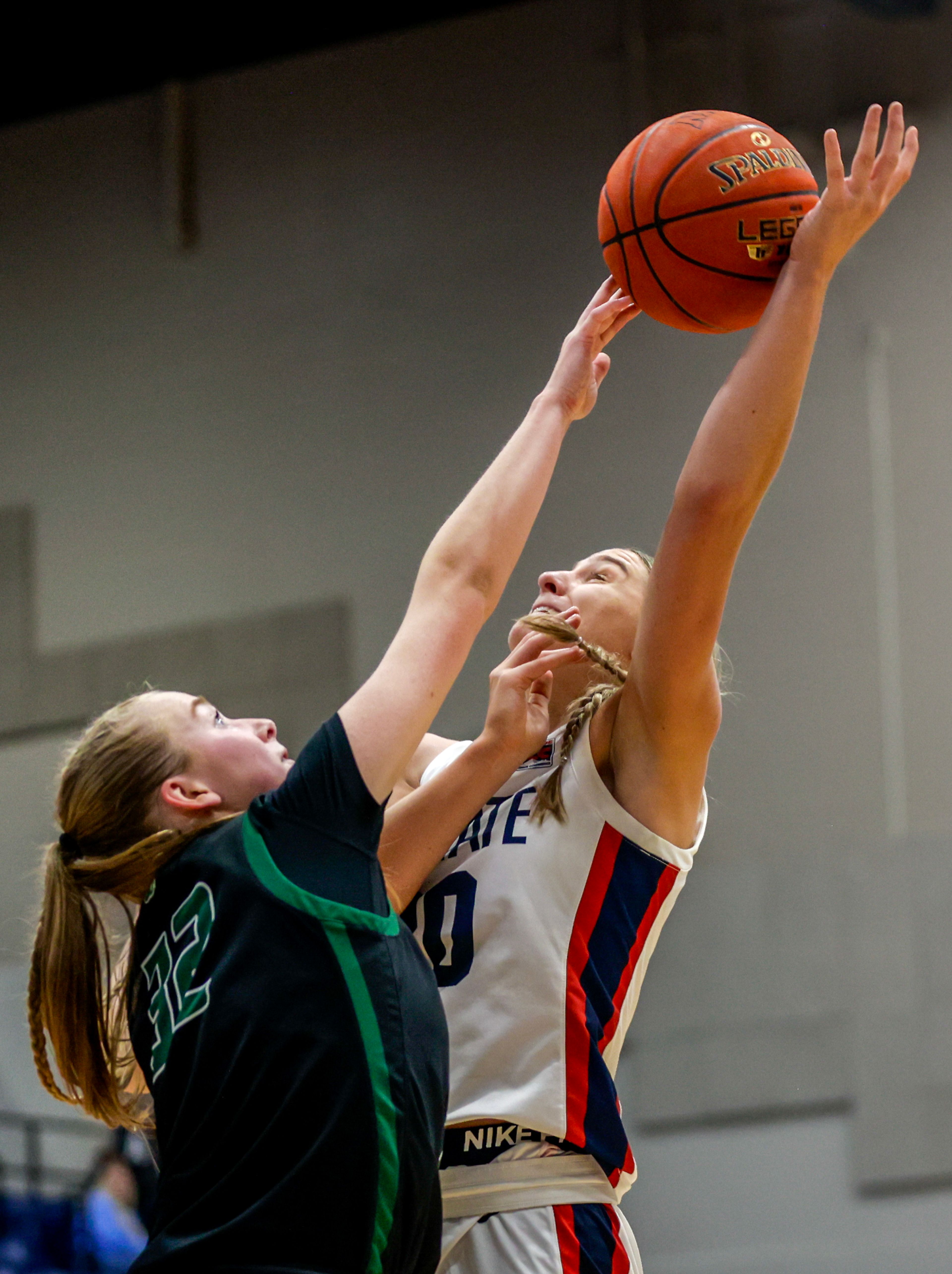 Lewis-Clark State forward Darian Herring attempts to shoot the ball as Walla Walla center Sidney Folkenberg guards her during a quarter of a Cascade Conference game Tuesday at Lewis-Clark State College in Lewiston.