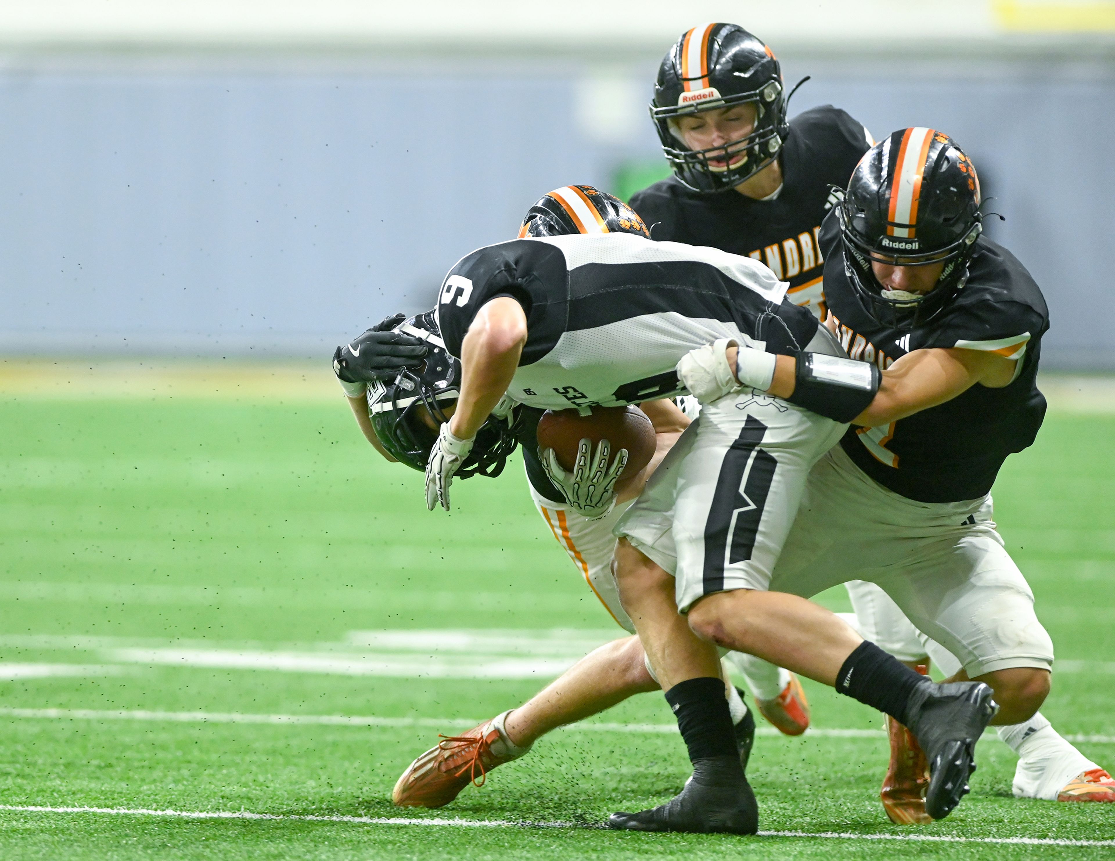 Kendrick’s Ralli Roetcisoender, right, tackles Butte County’s Koden Krosch Friday during the Idaho 2A football state championship game at the P1FCU Kibbie Dome in Moscow.