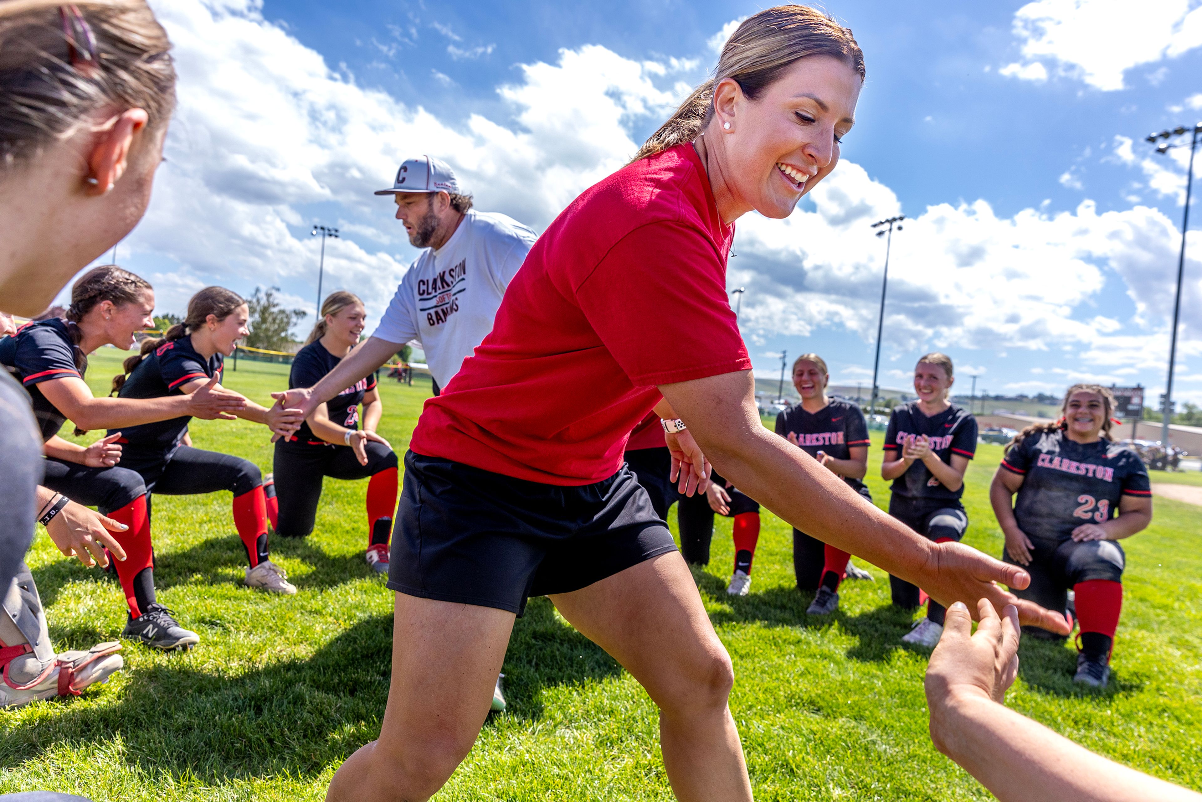 Clarkston head coach Kristin Wilson slaps hands with their team as they celebrate their victory over Shadle Park in the the District Championship Game Saturday in Clarkston.