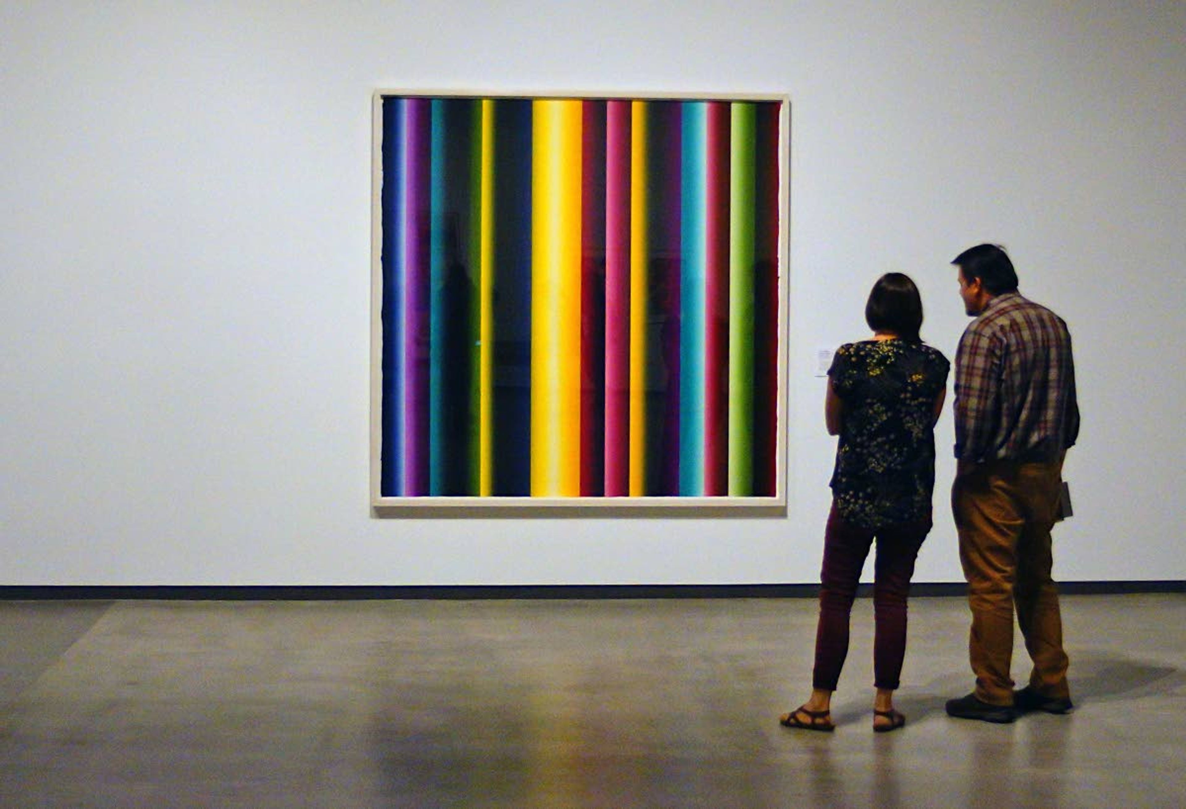 A couple examine a print by Polly Apfelbaum during an opening reception last week at the Jordan Schnitzer Museum of Art at Washington State University.