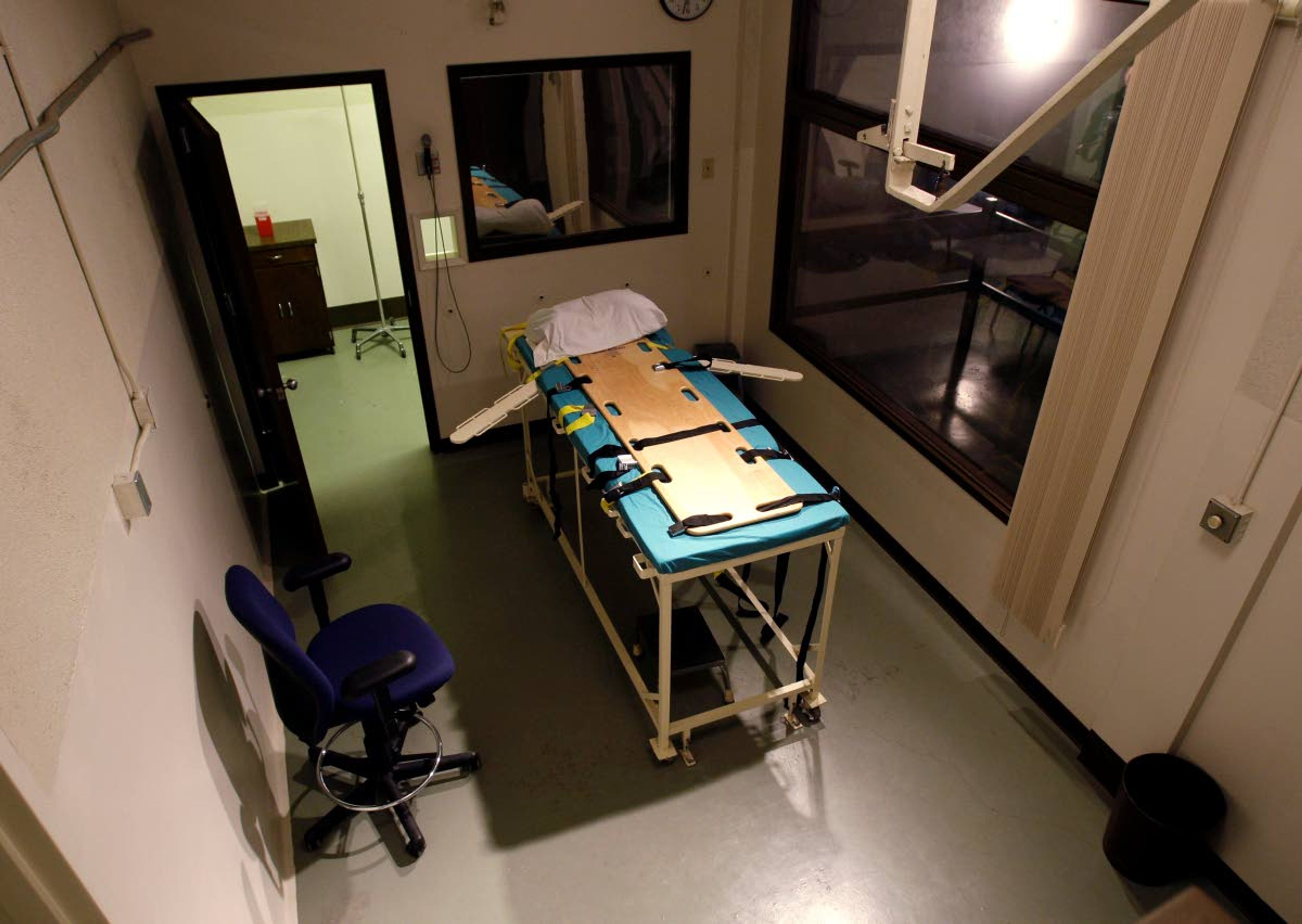 FILE - In this Nov. 20, 2008, file photo, the execution chamber at the Washington State Penitentiary is shown with the witness gallery behind glass at right, in Walla Walla, Wash. Washington state's Supreme Court has ruled that the death penalty violates its Constitution. The ruling Thursday, Oct. 11, 2018, makes Washington the latest state to do away with capital punishment. They ordered that people currently on death row have their sentences converted to life in prison. (AP Photo/Ted S. Warren, File)