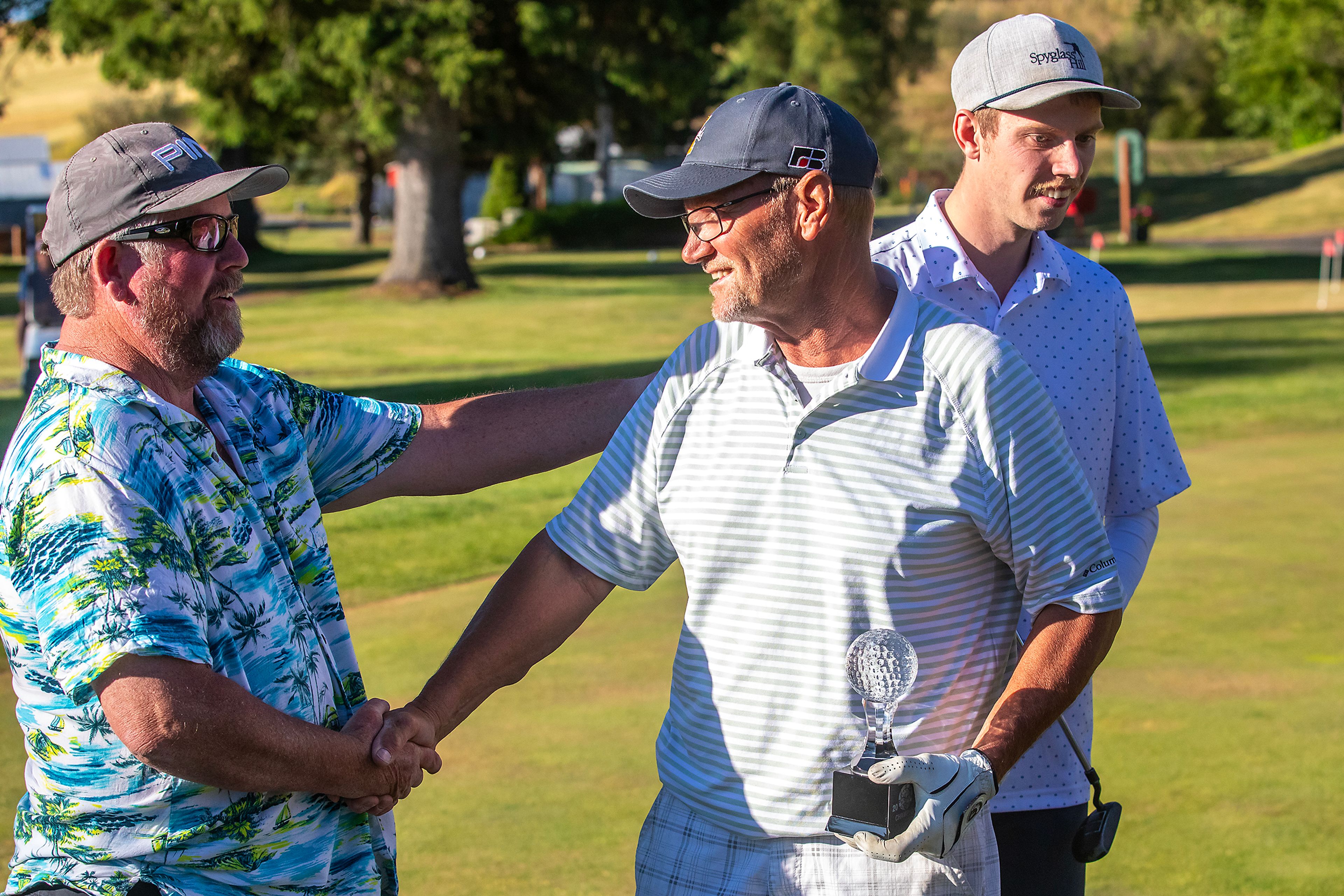 Kyle Nelson is congratulated on his victory in the annual Moscow Elks Lodge Golf Club Sole Survivor tournament Thursday in Moscow.