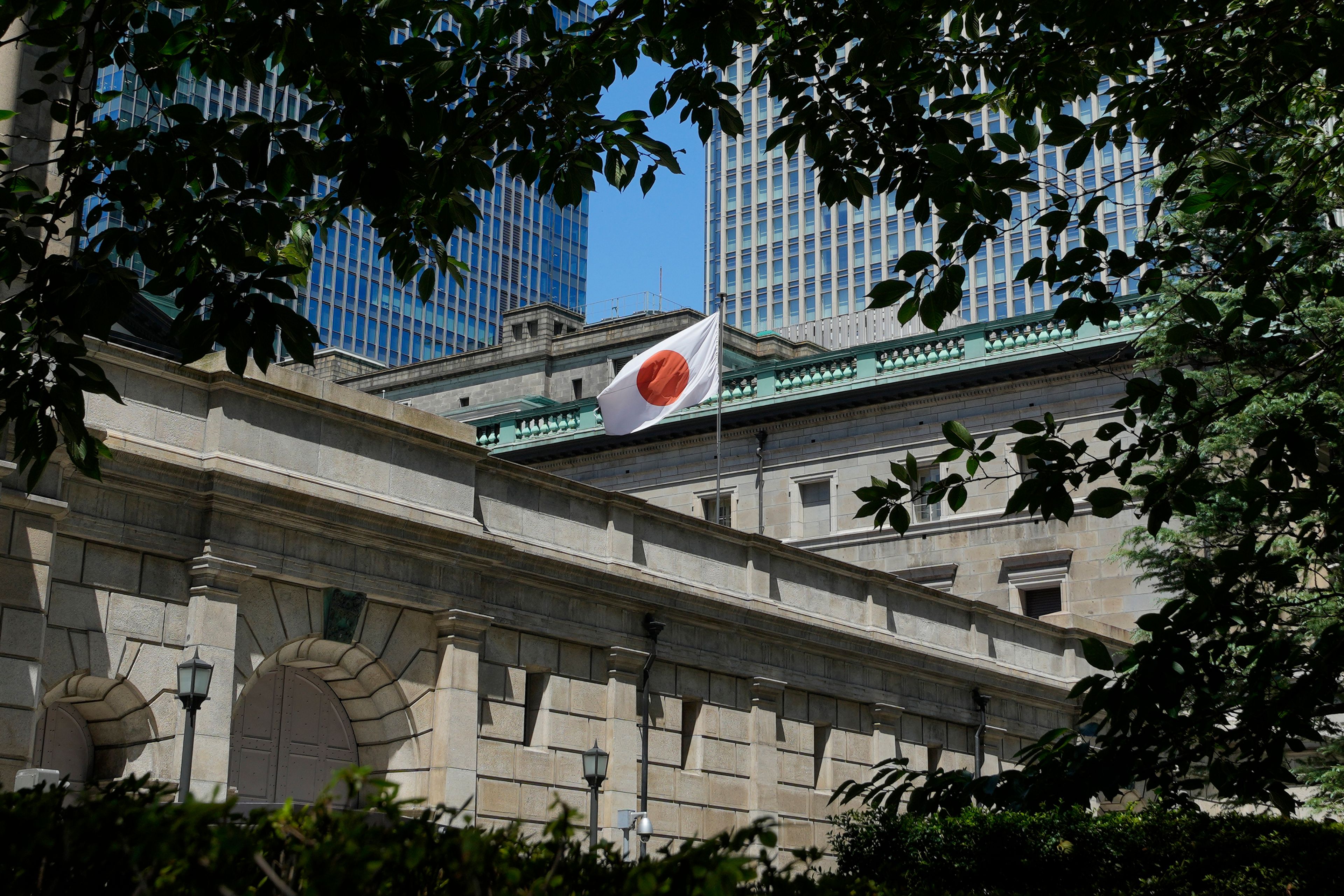 FILE - The headquarters of Bank of Japan (BOJ) is seen in Tokyo on Aug. 18, 2023. The Japanese economy shrank at an annual rate of 1.8% in the first quarter of this year, according to government data Monday, June 10, 2024, revised to be slightly better than the initial estimate at a 2.0% contraction.