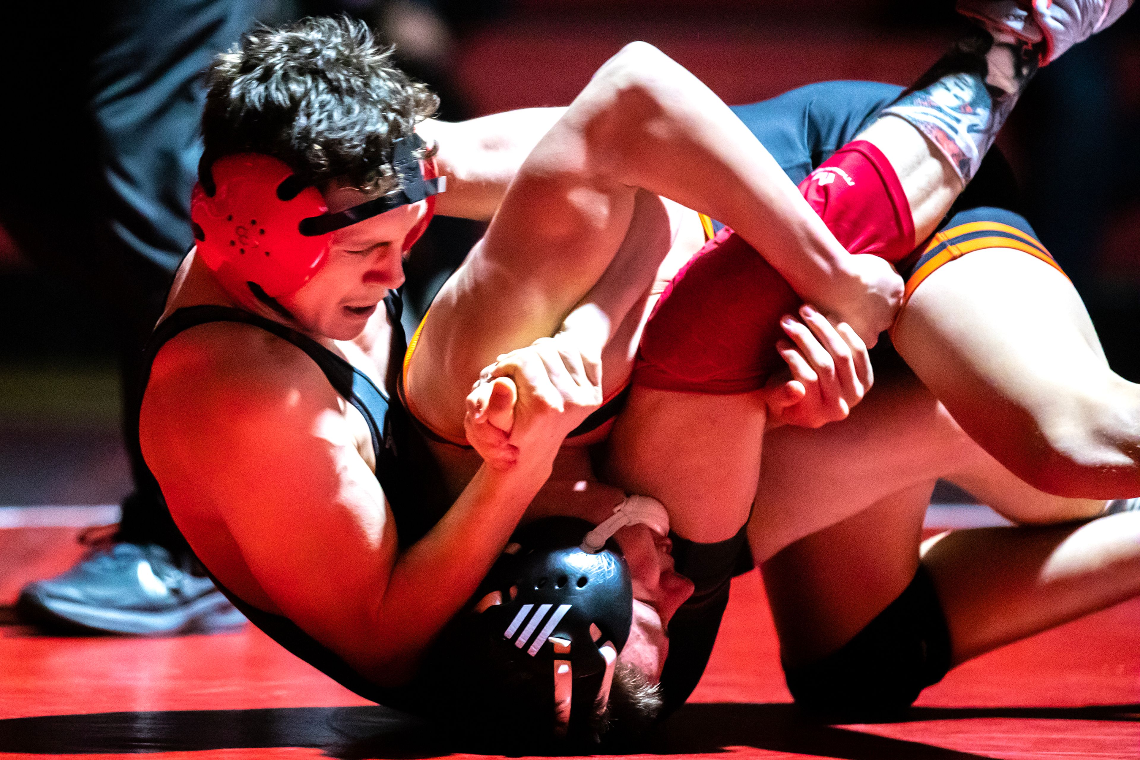 Clarkston’s Gabe Weza puts West Valley’s Kartyr Schroeder in a lock in the 132 pound weight class match during a wrestling duel Wednesday at Clarkston.