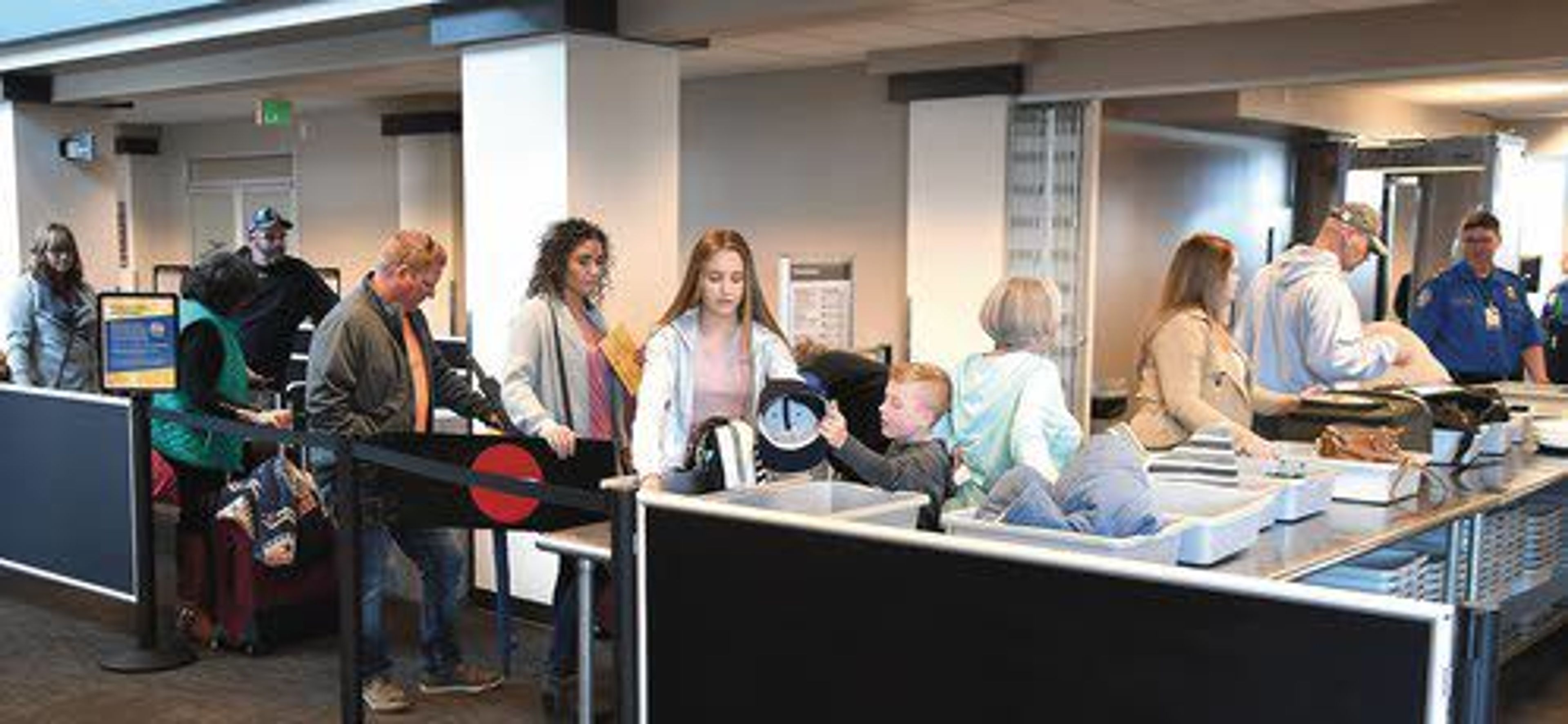 Passengers leaving from the Lewiston-Nez Perce County Airport file through airport security last week.