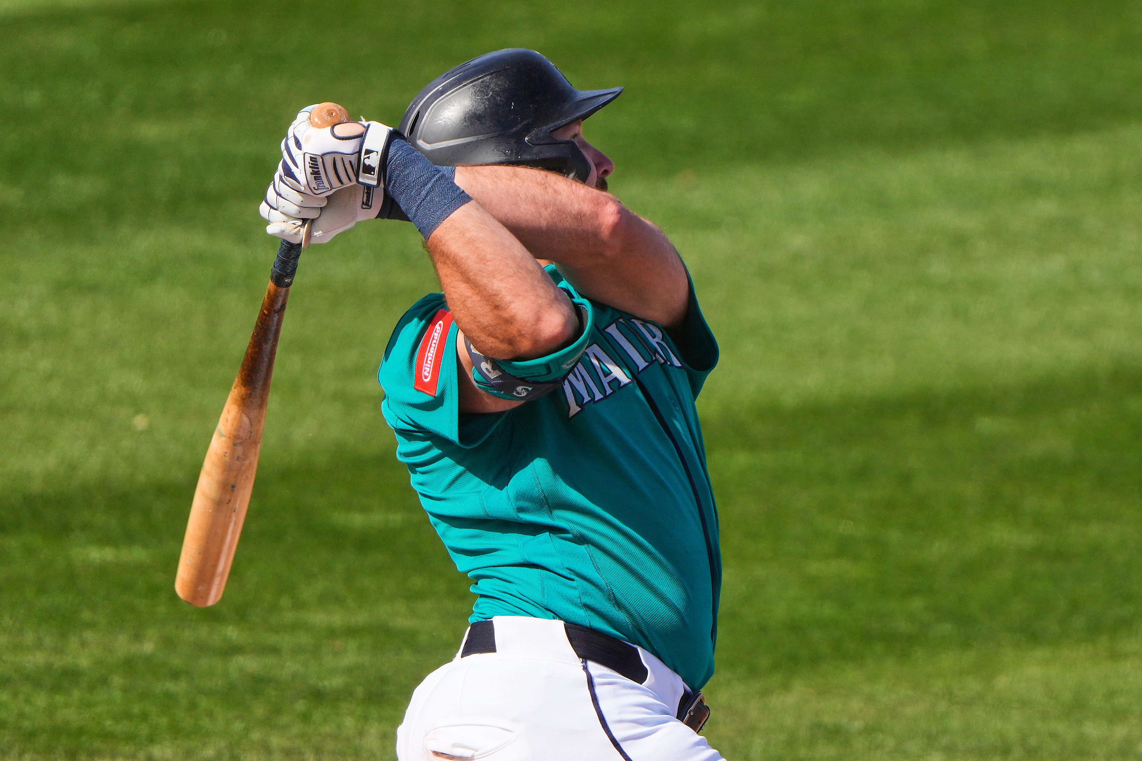 The Mariners’ Cal Raleigh watches his two-run home run during the third inning of a spring training game against the White Sox on Tuesday in Peoria, Ariz.