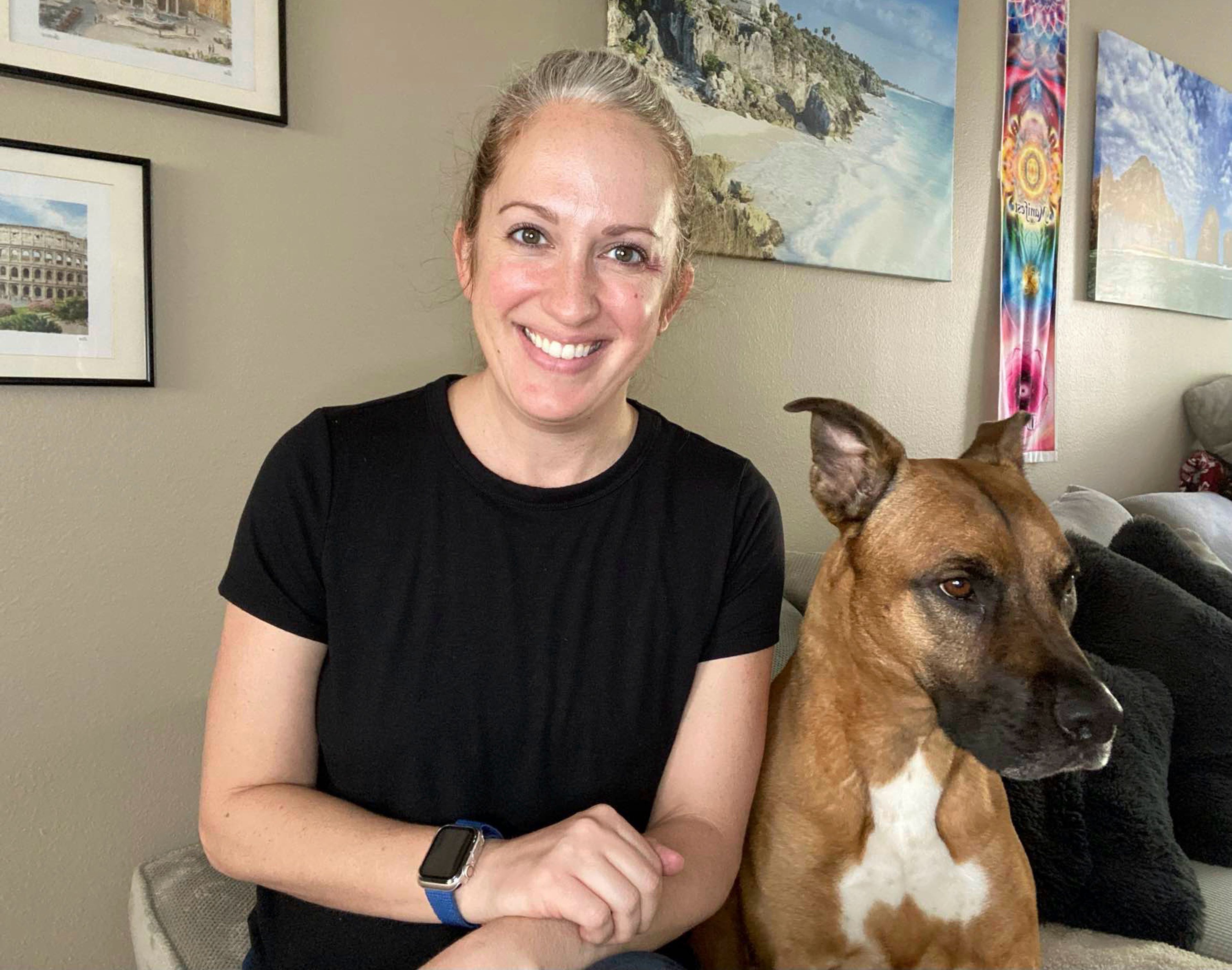 Lindsey Kee poses with her dog Teddy Ruffsavel at her home in Portland, Oregon, on Aug. 3, 2024. Kee created an exercise routine around walking her dog,