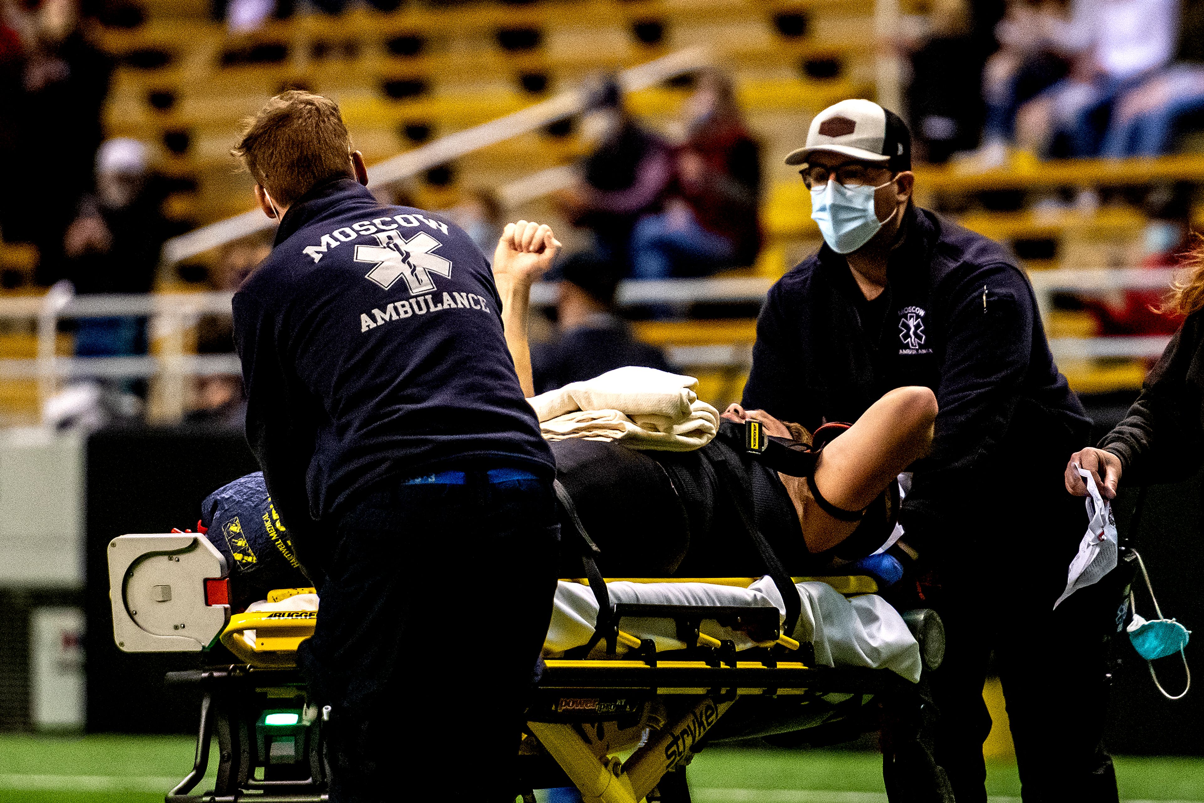 Prairie’s Dean Johnson raises a single fist as he’s carted off the field with a broken ankle in Prairie’s game against Oakley. The Prairie Pirates lost to the Oakley Hornets 42-40 in the Class 1A Division O state semifinal football game at the Kibbie Dome in Moscow on Friday.