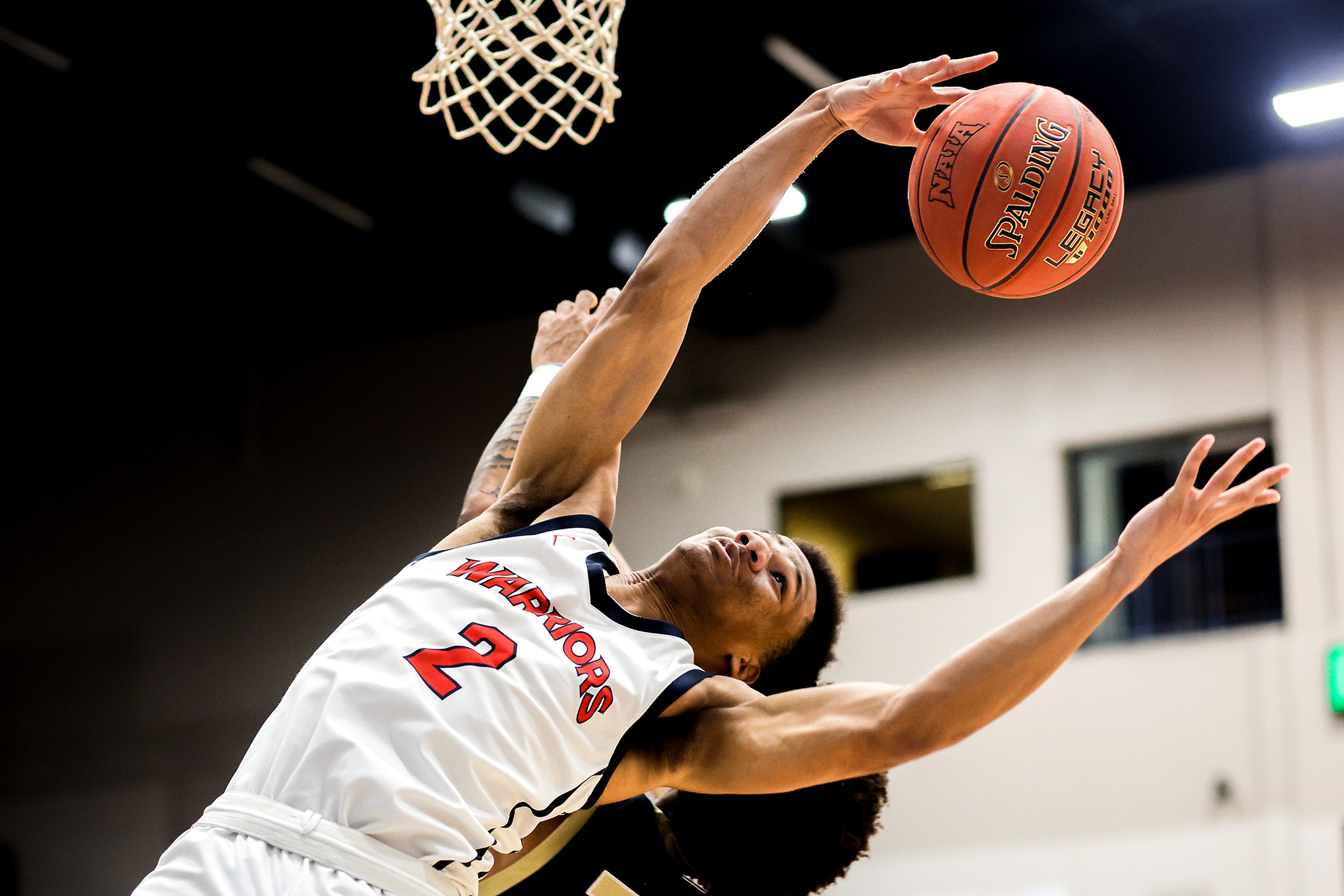 Lewis-Clark State guard Davian Brown reaches back to grab a rebound during Friday's Cascade Conference game against Eastern Oregon at Lewis-Clark State College.