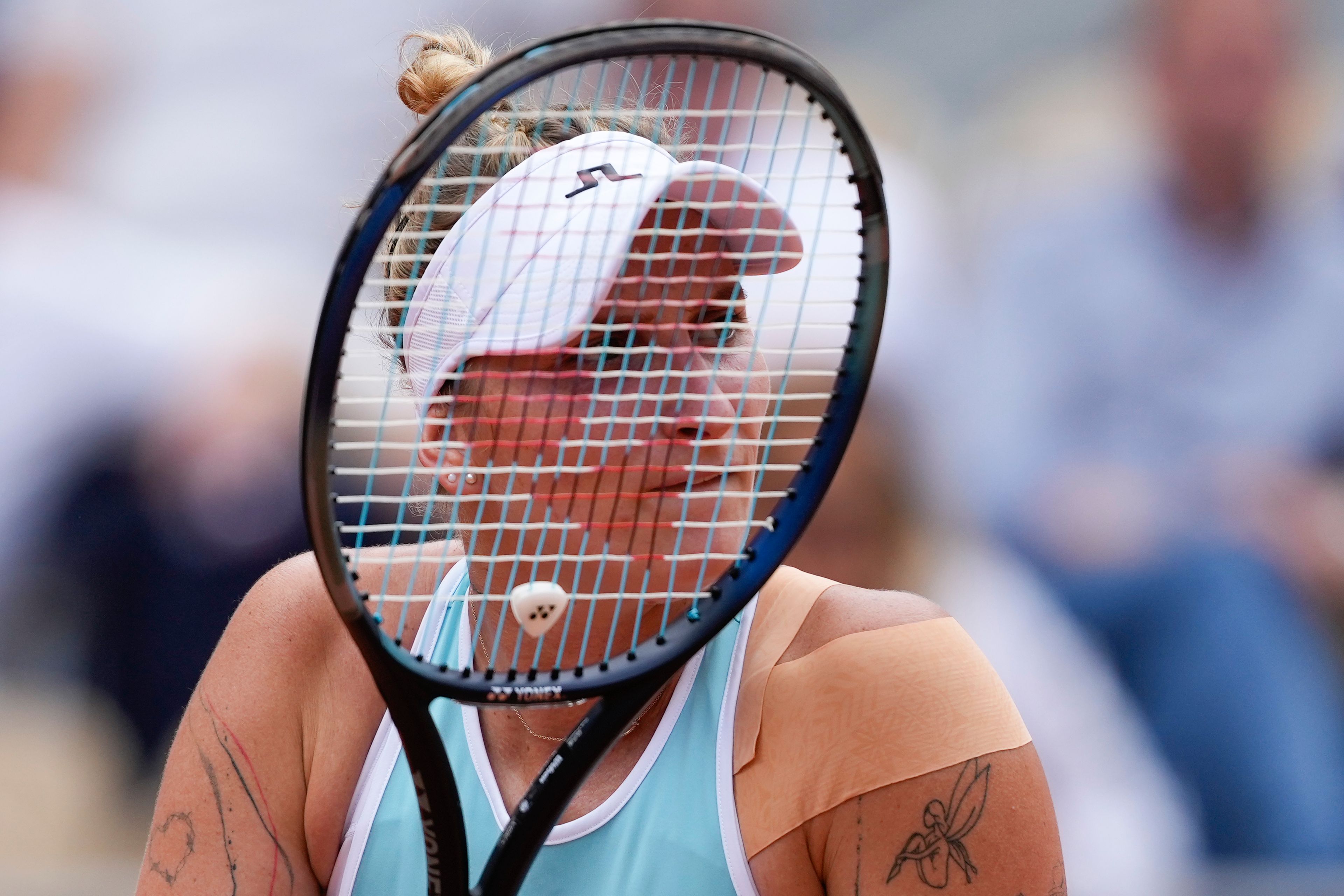 Marketa Vondrousova of the Czech Republic plays a shot against Poland's Iga Swiatek during their quarterfinal match of the French Open tennis tournament at the Roland Garros stadium in Paris, Tuesday, June 4, 2024.