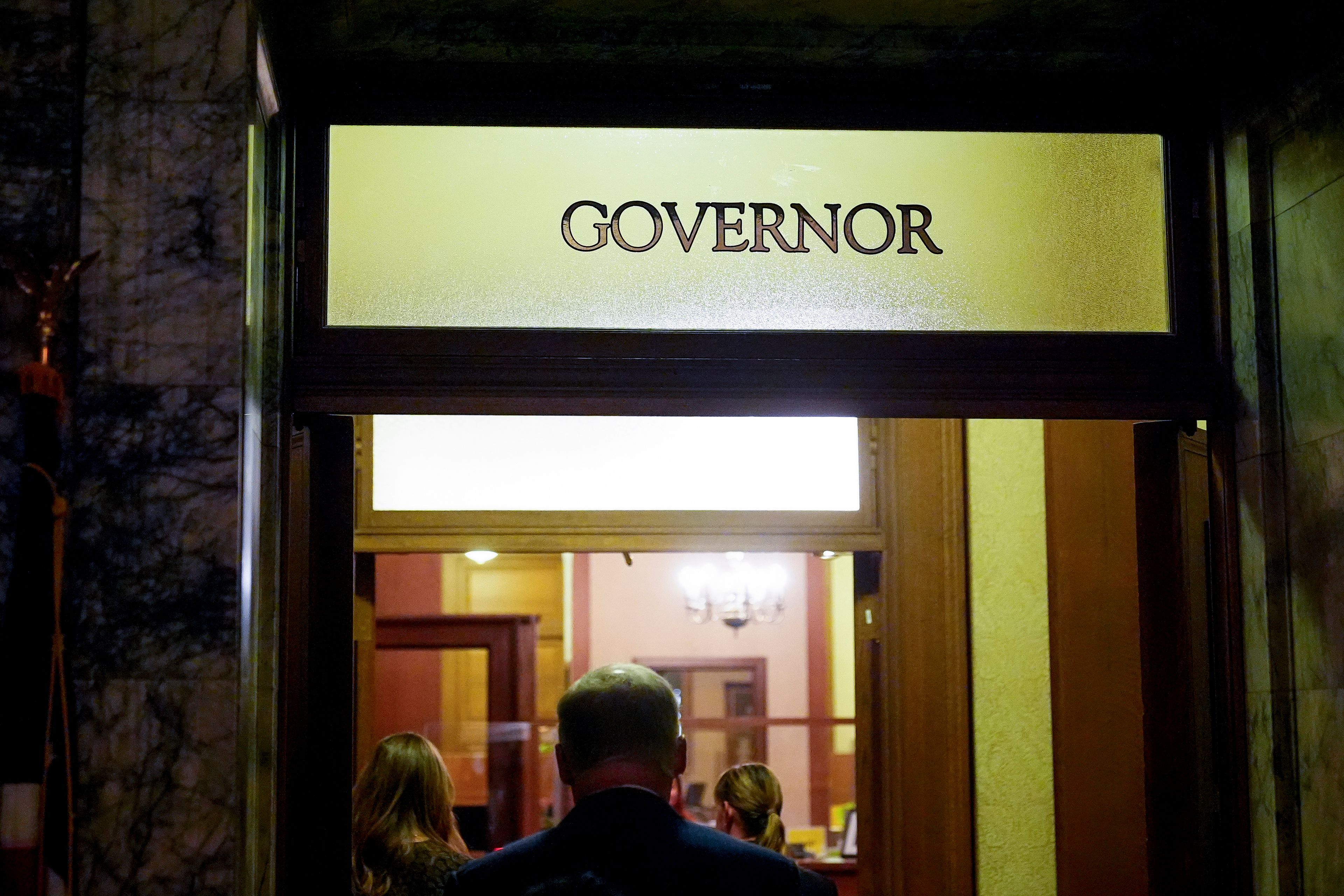 Washington Gov. Jay Inslee returns to his office after delivering his State of the State address on the second day of the legislative session at the Washington state Capitol, Tuesday, Jan. 9, 2024, in Olympia, Wash. (AP Photo/Lindsey Wasson)