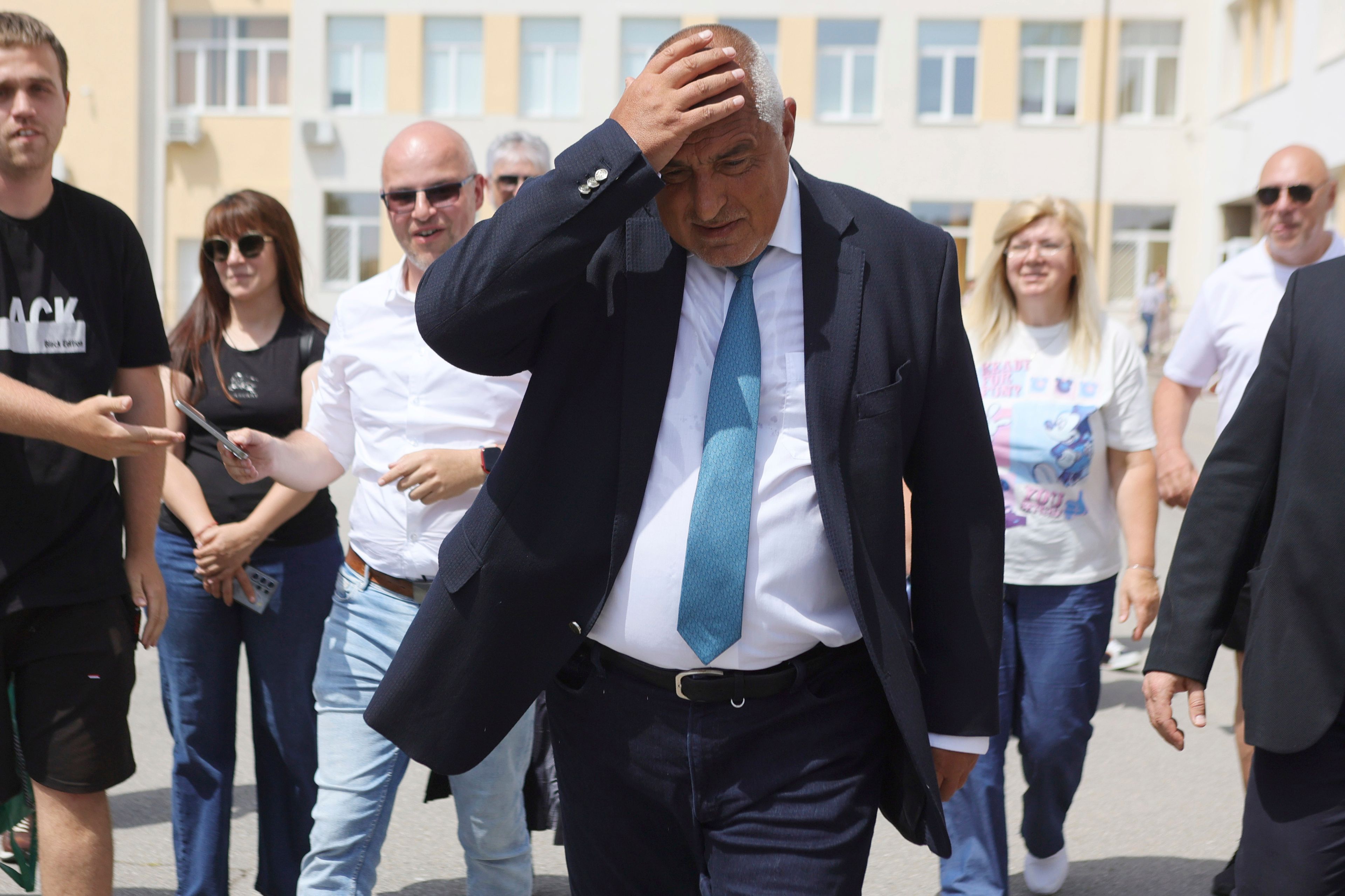 Bulgarian former Prime Minister Boyko Borissov walks after casting his vote at a polling station in Bankya, Sunday, June 9, 2024. Voters in Bulgaria are going to the polls on Sunday in national and European Parliament elections that have been overshadowed by political instability, economic inequality and growing concern over the war in nearby Ukraine.