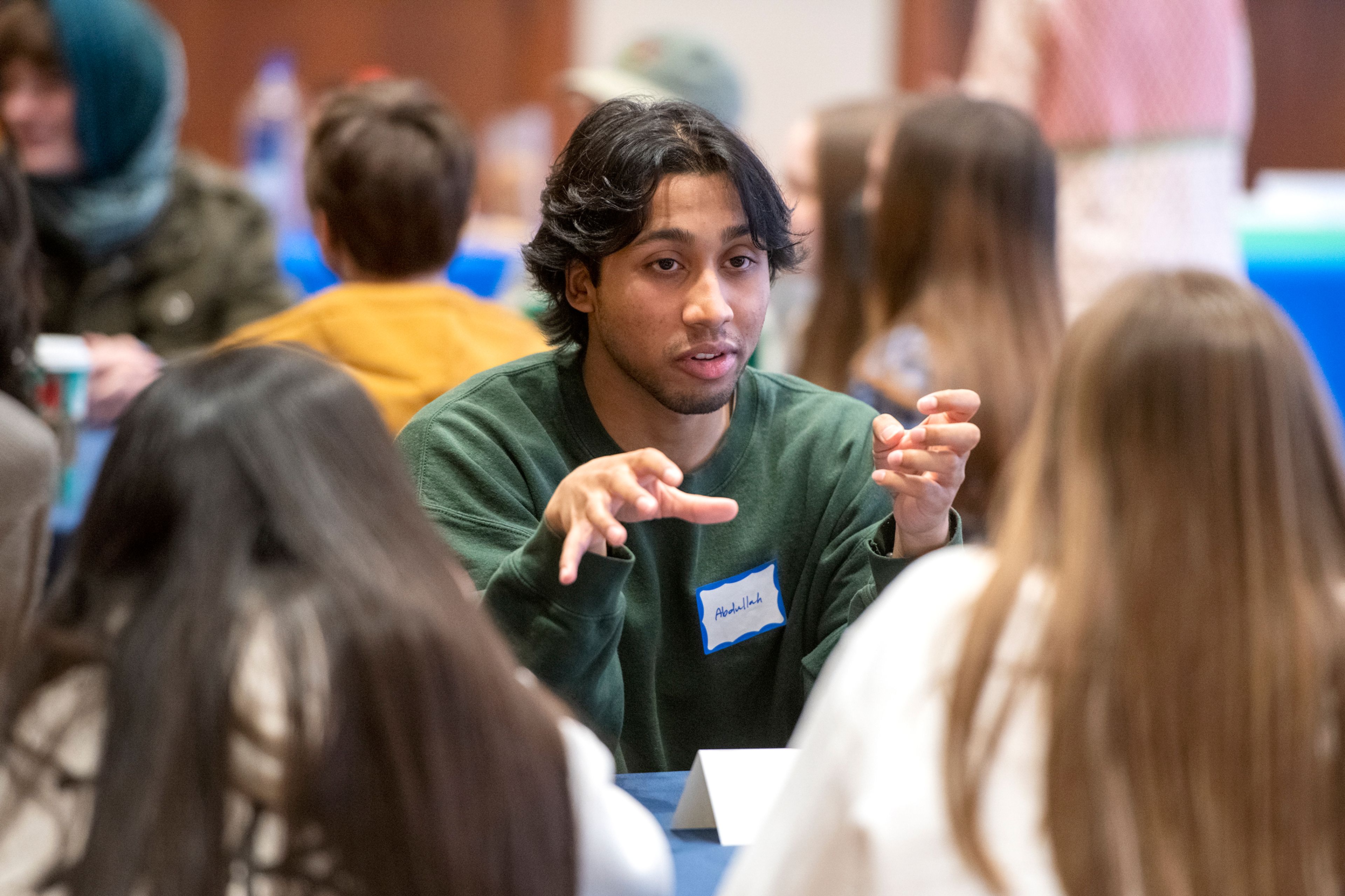 Abdullah Islam, a student at Columbia University, speaks with high school students during a Palouse Pathways event at the 1912 Center in Moscow on Wednesday.