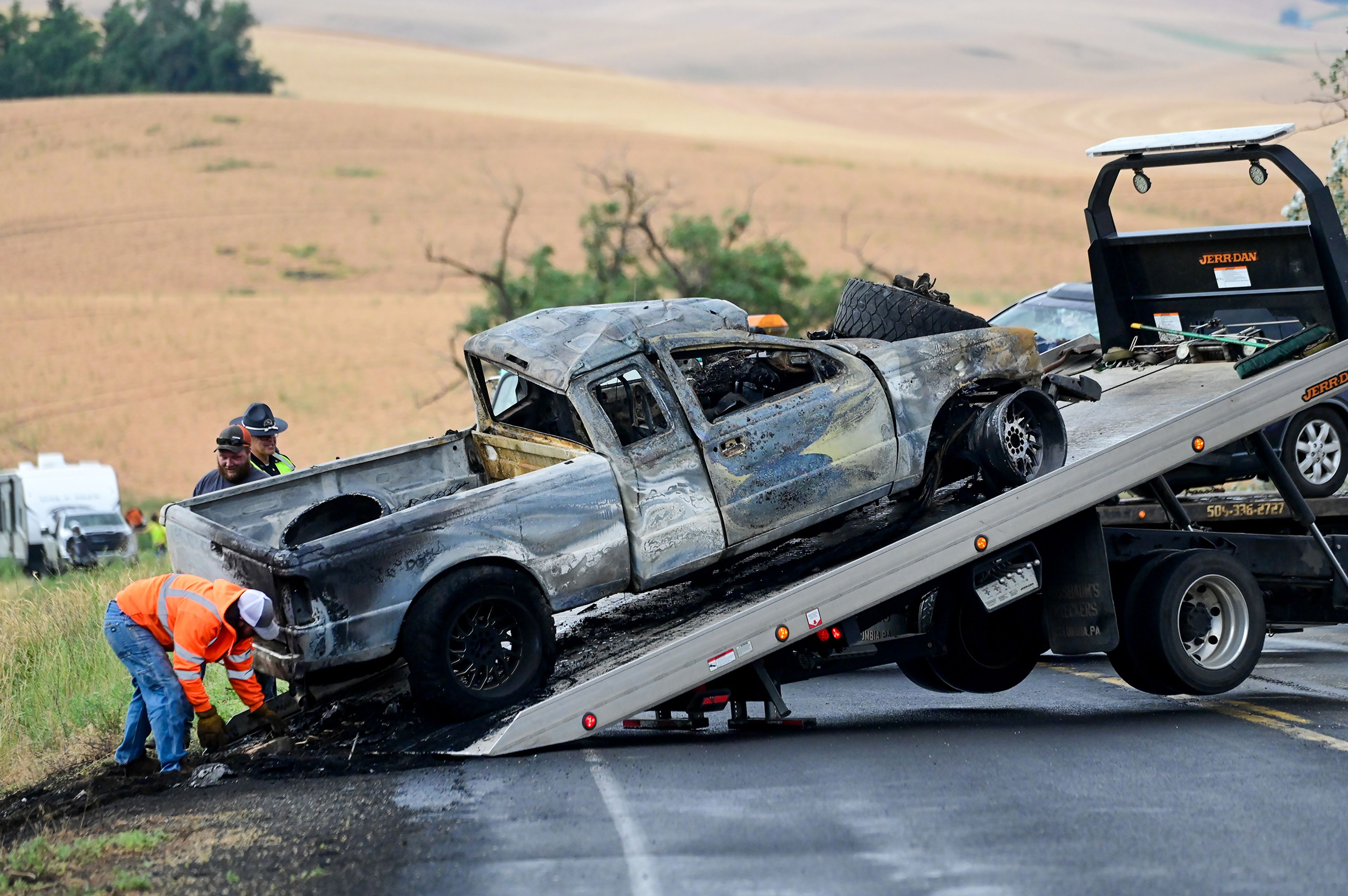 A truck gets pulled away following a crash on US Highway 95 south of Moscow on Monday.