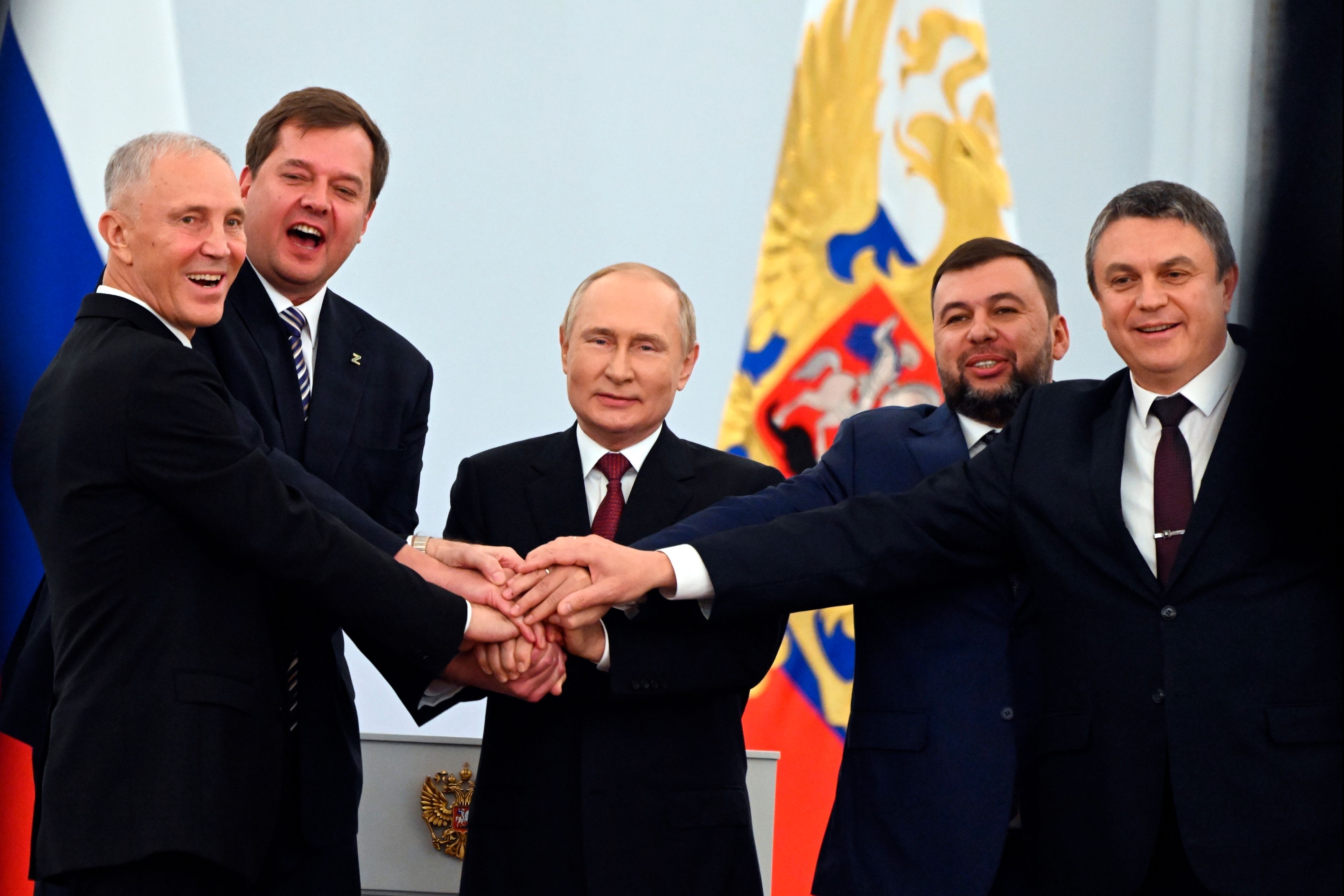 FILE - From left, Vladimir Saldo, the head of the Kherson region; Yevgeny Balitsky, the head of the Zaporizhzhia region; Russian President Vladimir Putin, center; Denis Pushilin, head of the self-proclaimed Donetsk People's Republic; and Leonid Pasechnik, head of the self-proclaimed Luhansk People's Republic, pose at a ceremony to sign treaties to illegally annex Ukrainian territories at the Kremlin in Moscow, on Friday, Sept. 30, 2022. Putin has argued that Ukrainians and Russians historically have always been one people, and that Ukraine's sovereignty is merely an illegitimate holdover from the Soviet era. In Russia, history has long become a propaganda tool used to advance the Kremlin's political goals. (Grigory Sysoyev, Sputnik, Kremlin Pool Photo via AP, File)