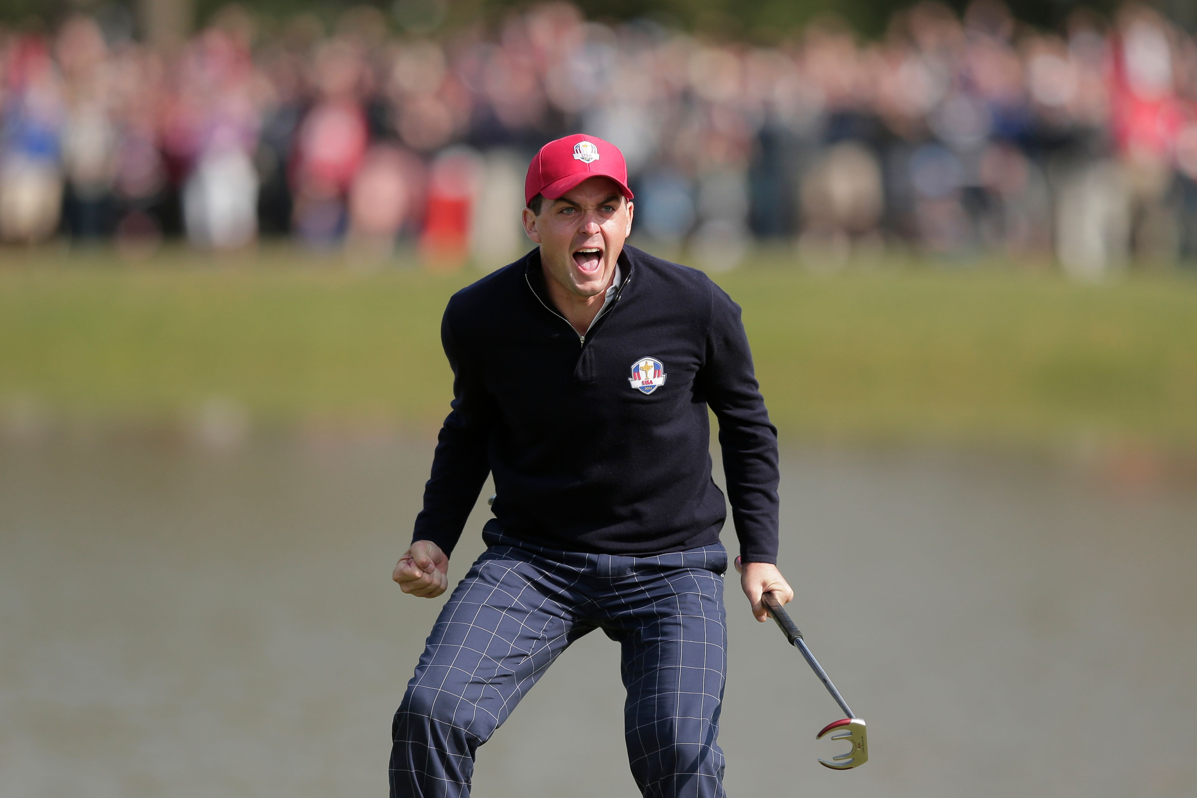 FILE - USA's Keegan Bradley celebrates after winning their foursomes match on the 15th hole at the Ryder Cup golf tournament, Friday, Sept. 28, 2012, at Medinah Country Club in Medinah, Ill. Bradley was selected as U.S. Ryder Cup captain for 2025, The PGA of America announced Monday, July 8, 2024. (AP Photo/Charlie Riedel, File)