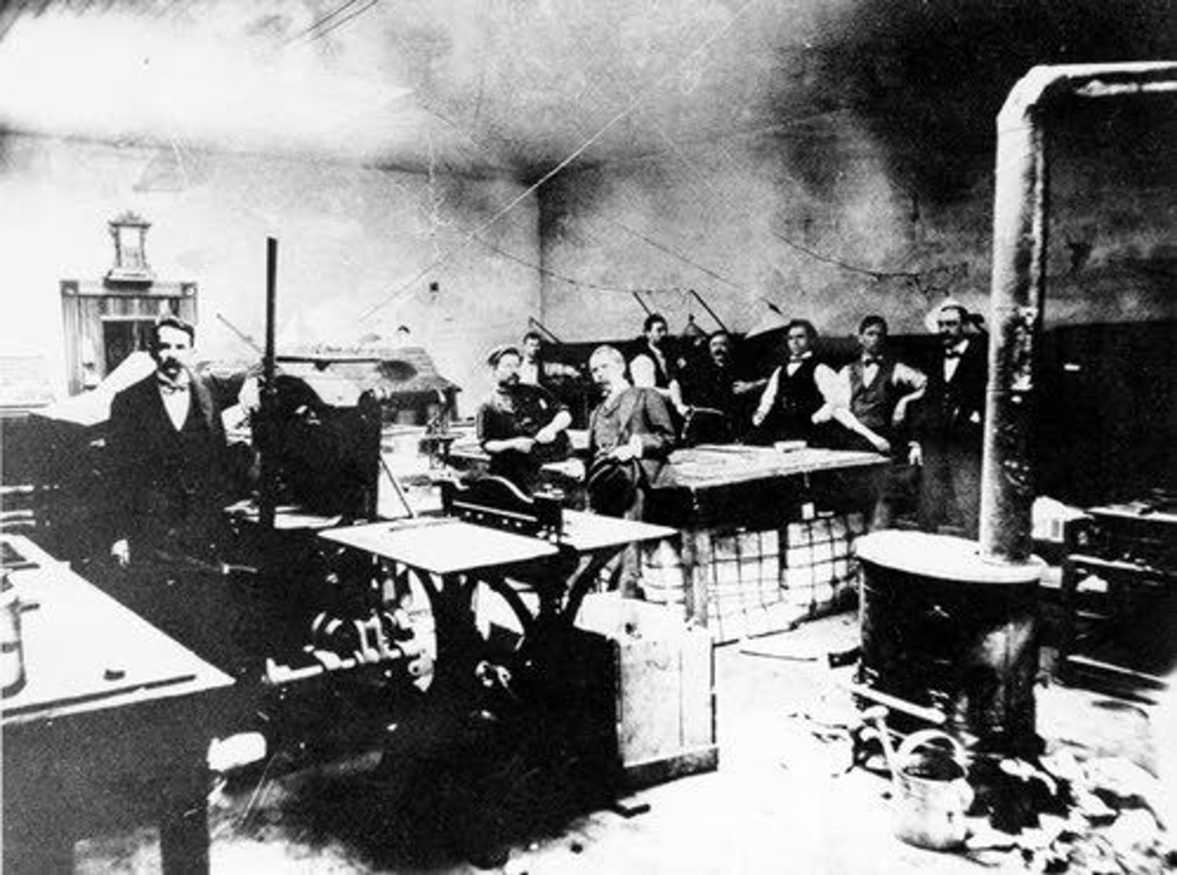 Tribuine file photoEditor Albert H. Alford (left) and his brother, business manager Eugene L. Alford (in suit leaning on table), left Texas for the Northwest, eventually arriving in Lewiston in 1892 with plans to start a newspaper.