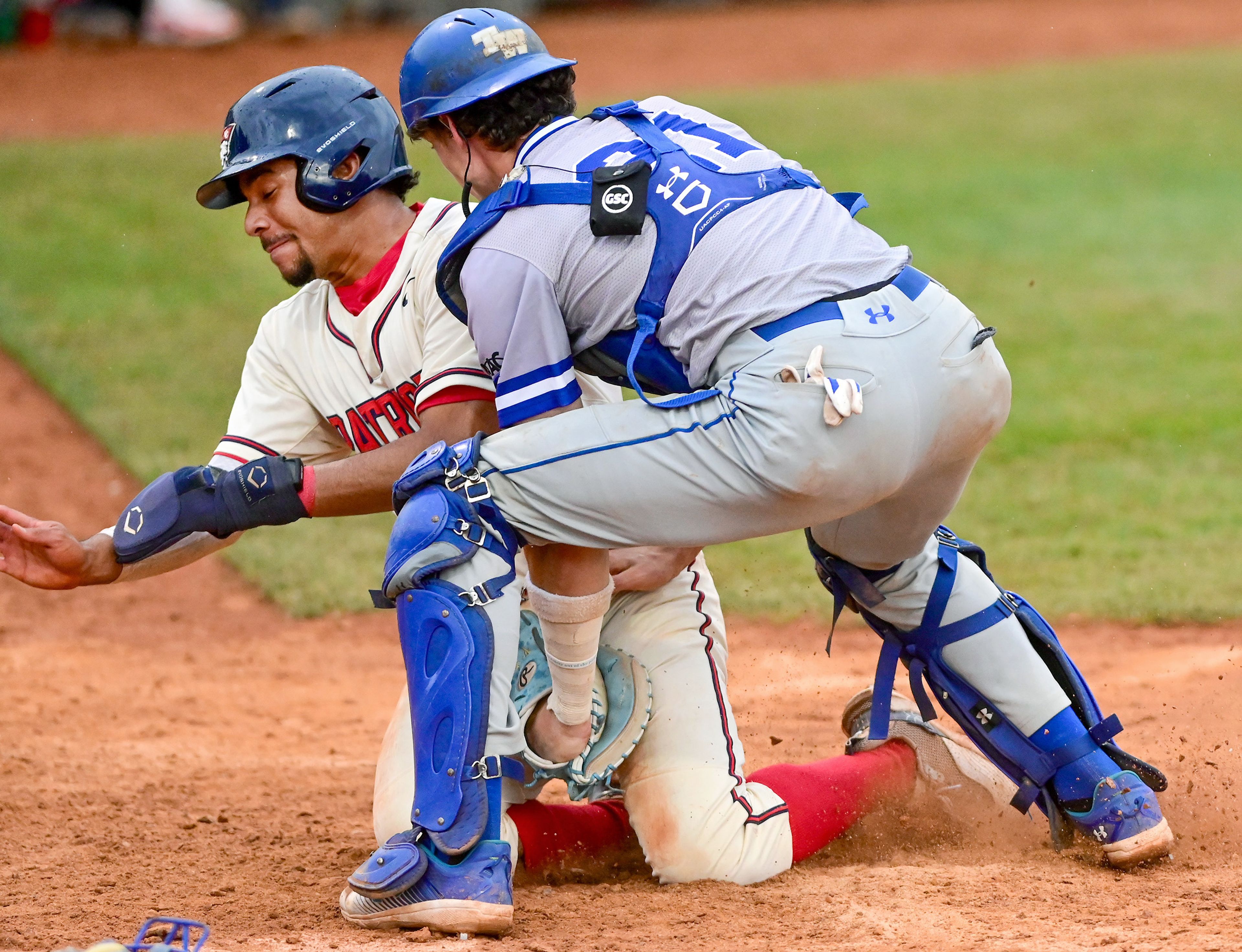 Cumberlands Christian Thompson is pushed away from the home base with a tag out by Tennessee Wesleyan catcher Daniel Stewart on the opening day of the NAIA World Series at Harris Field in Lewiston on Friday.